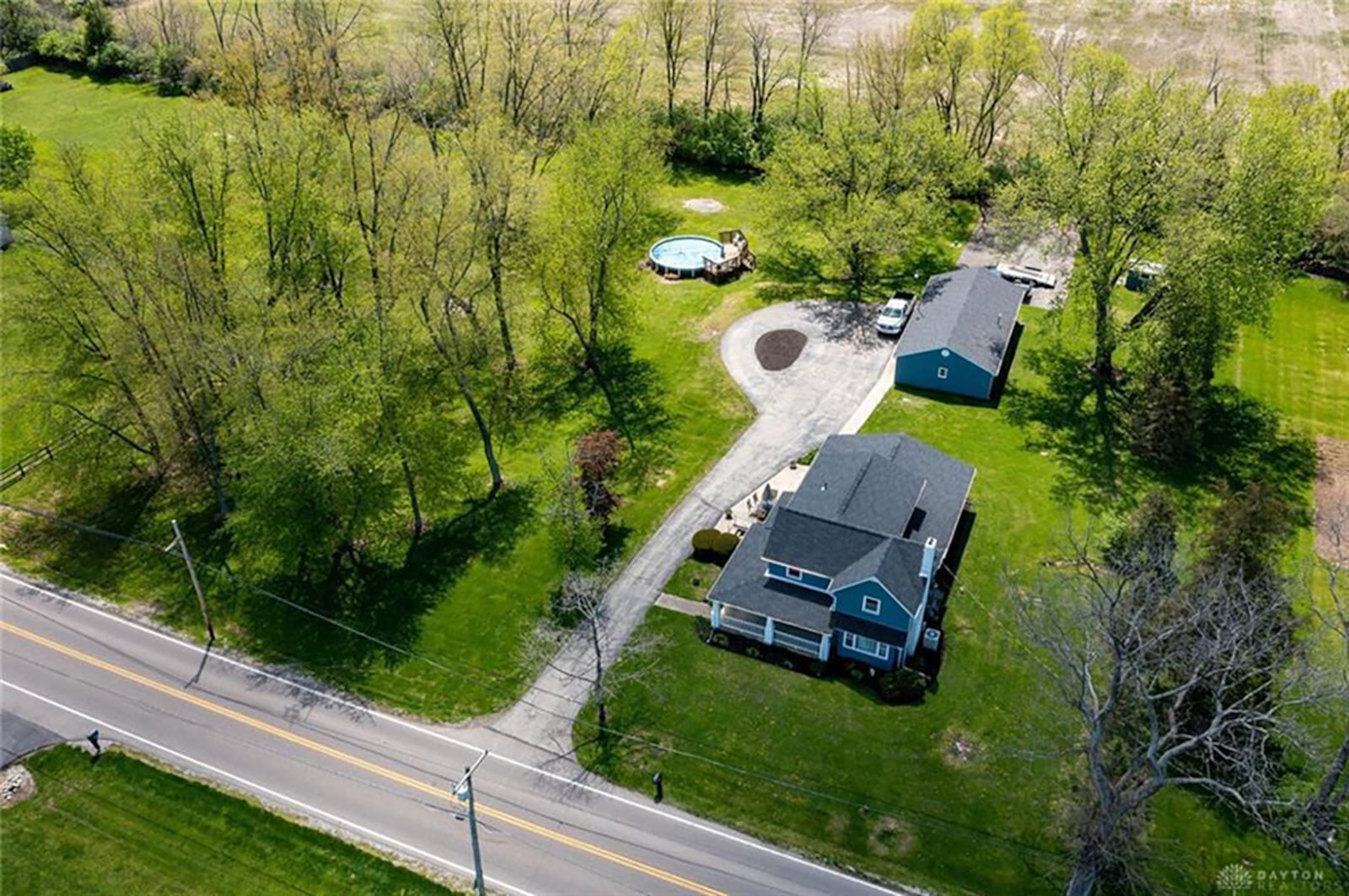 The home is set on 1.73 acres of woods and open space. A concrete drive leads to the farmhouse and continues to the rear of the property and the separate garage and workshop. CONTRIBUTED PHOTO