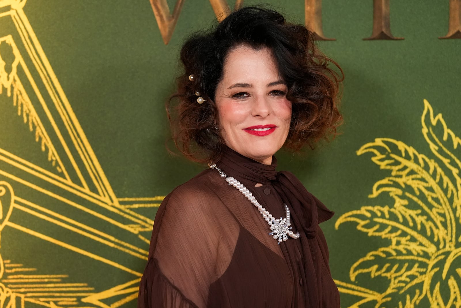 Parker Posey arrives at the season three premiere of "The White Lotus" on Monday, Feb. 10, 2025, at Paramount Theater in Los Angeles. (AP Photo/Chris Pizzello)