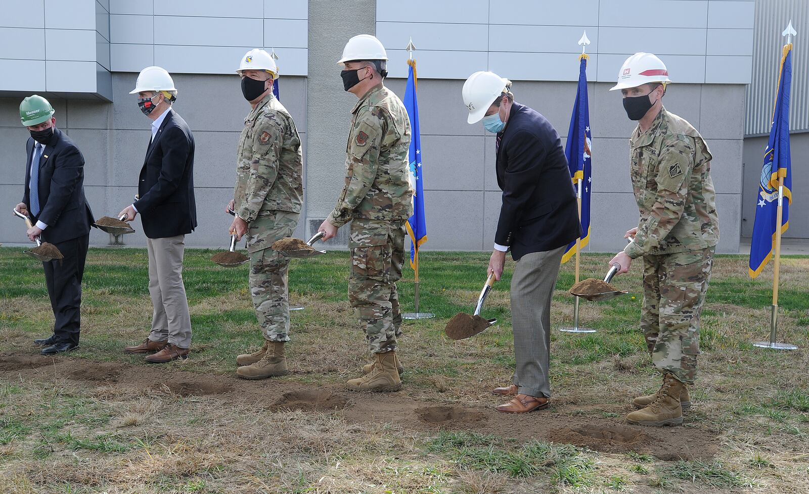 Military and civilian dignitaries break ground for the National Air and Space Intelligence Center's (NASIC) Intellingence Production Complex lll military construction project at Wright-Patterson Air Force Base on Thursday afternoon. Construction for the 150 $3 million complex is expected to begin later this month and will be completed in early to 2025. MARSHALL GORBY\STAFF