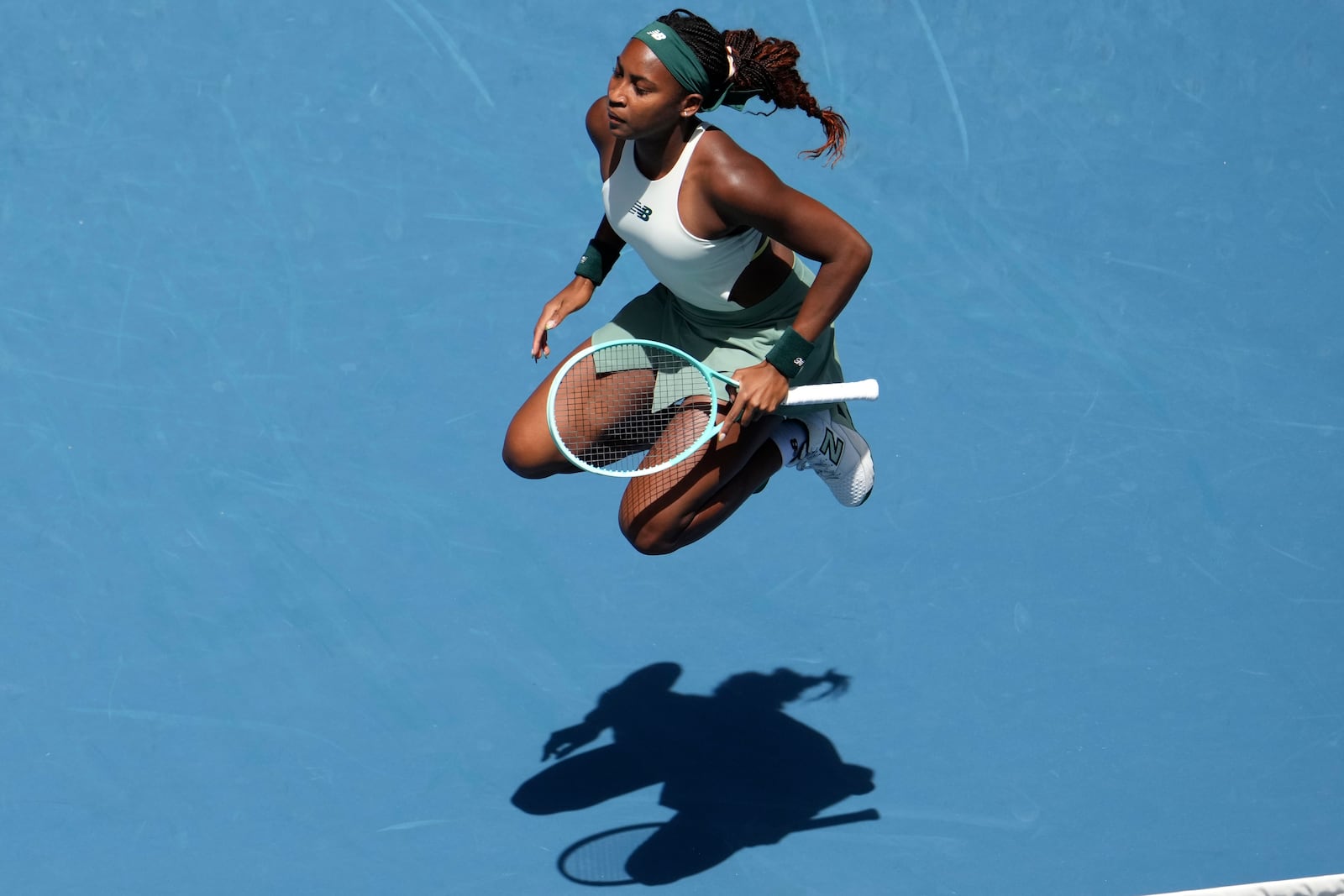 Coco Gauff of the U.S. warms up before a fourth round match against Belinda Bencic of Switzerland at the Australian Open tennis championship in Melbourne, Australia, Sunday, Jan. 19, 2025. (AP Photo/Mark Baker)