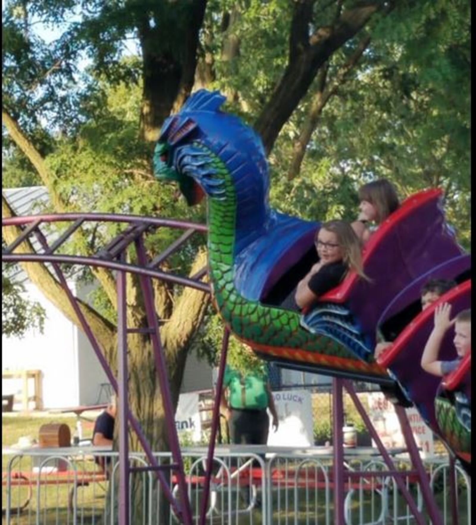 The granddaughter of Missy McGovern-Prather is in the front left seat of this ride Saturday at the Miami County Fair in Troy. The ride malfunctioned. The seven children aboard were not injured, officials said. (Courtesy/Missy McGovern-Prather)