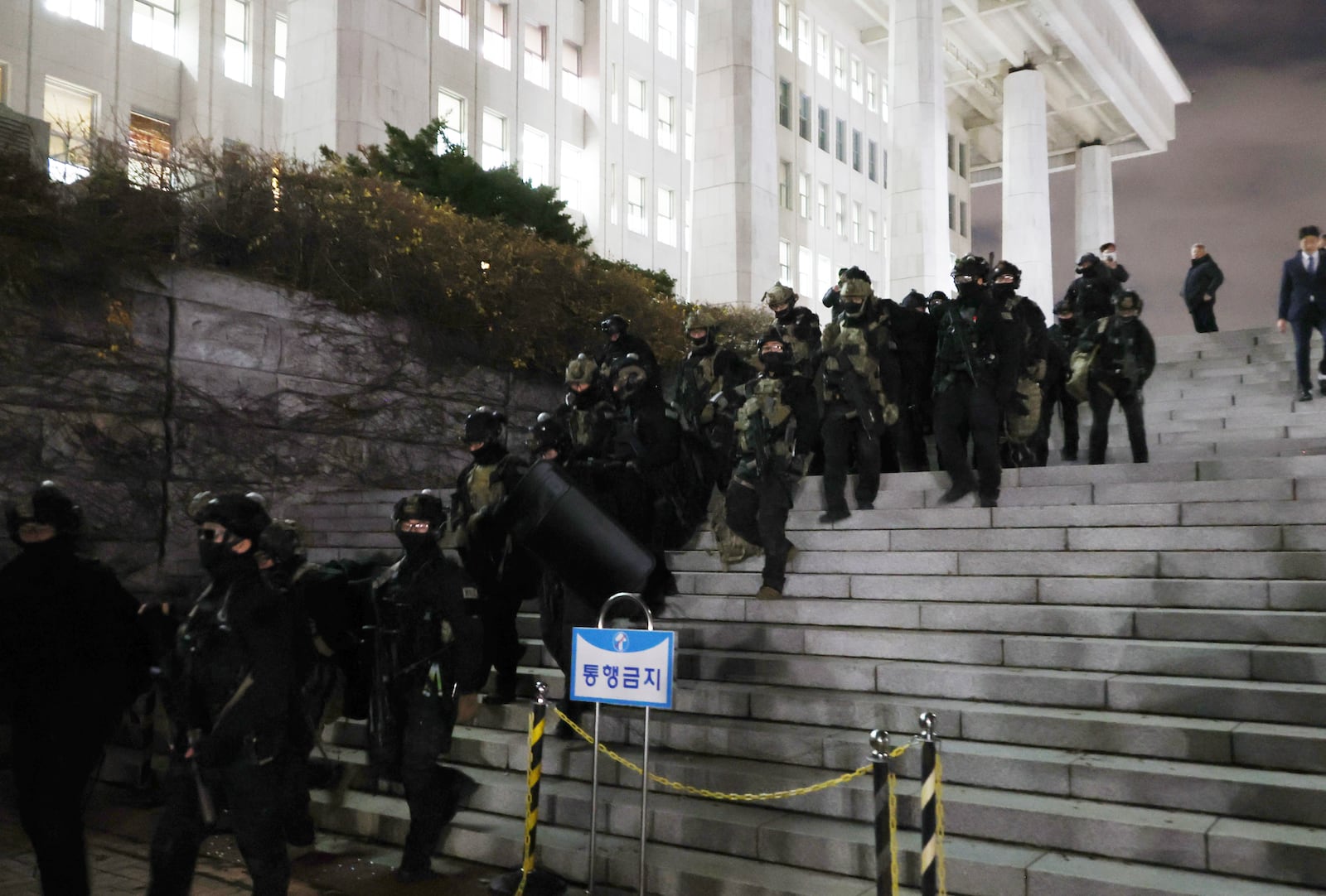 South Korean martial law soldiers leave the National Assembly in Seoul, South Korea, Wednesday, Dec. 4, 2024. (Kim Ju-sung/Yonhap via AP)