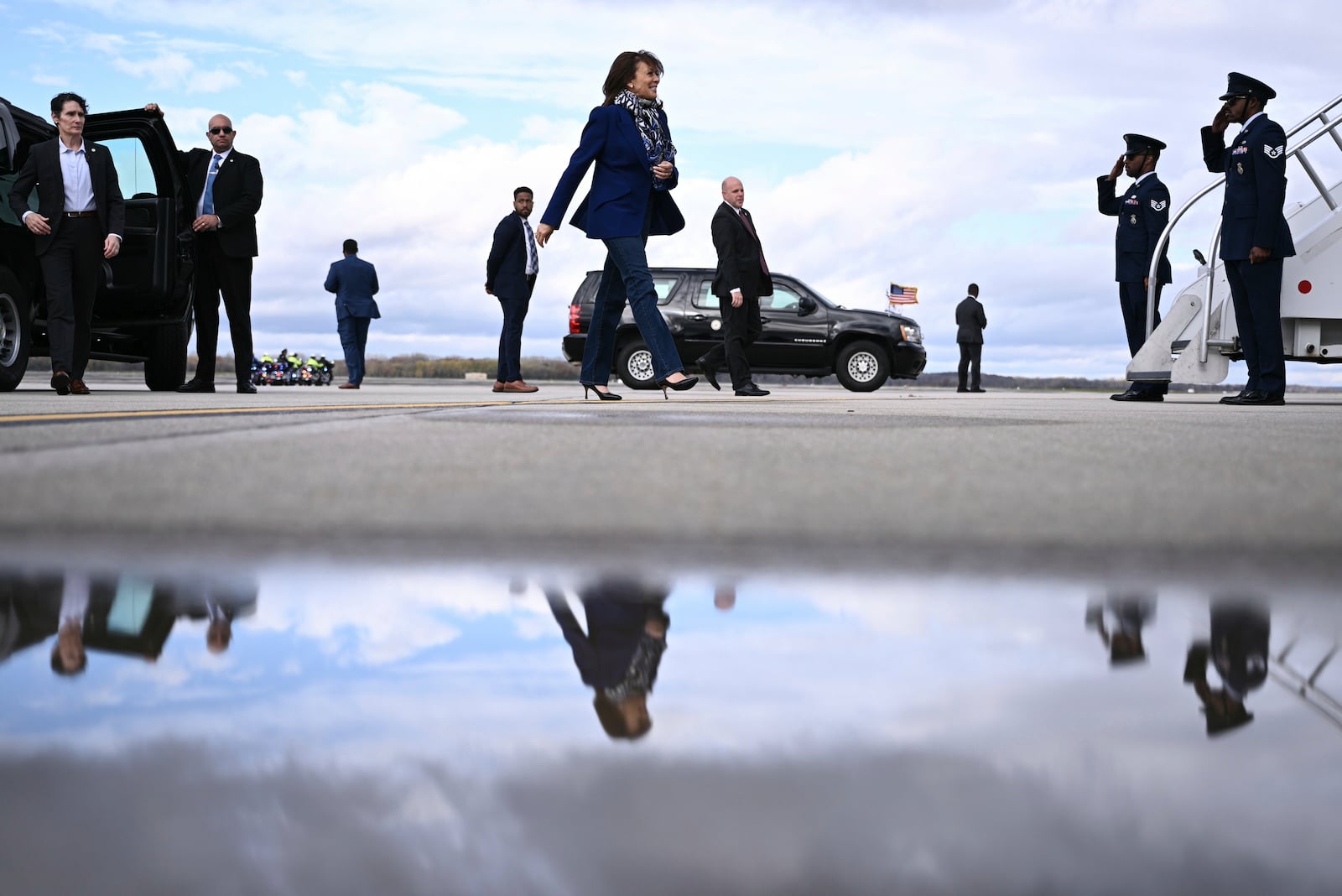 Democratic presidential nominee Vice President Kamala Harris walks to board Air Force Two before departing Dane County Regional Airport in Madison, Wis., Oct. 31, 2024. (Brendan Smialowski/ Pool via AP)