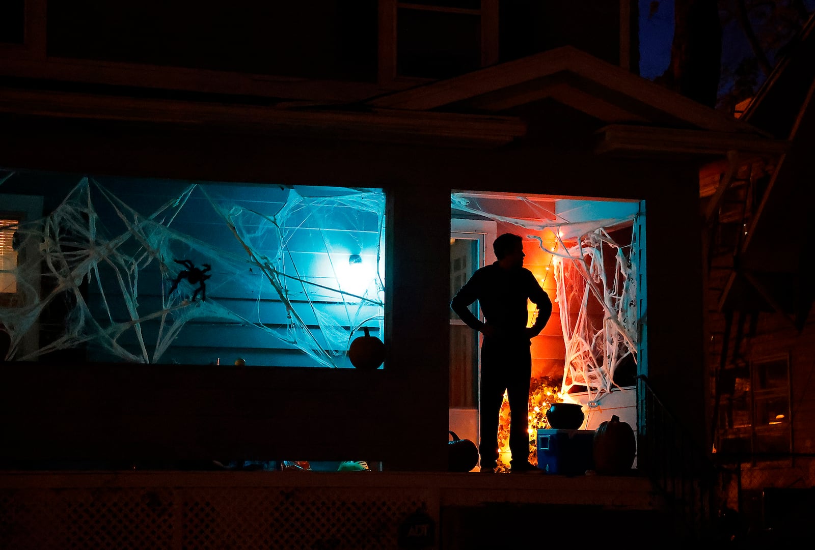 A resident waits on his decorated front porch for trick or treaters Saturday, Oct. 29, 2022. The sidewalks in Springfield were filled with ghouls and goblins with the occasional super hero and princess thrown in for good measure during this year's Trick or Treat in Clark County. 