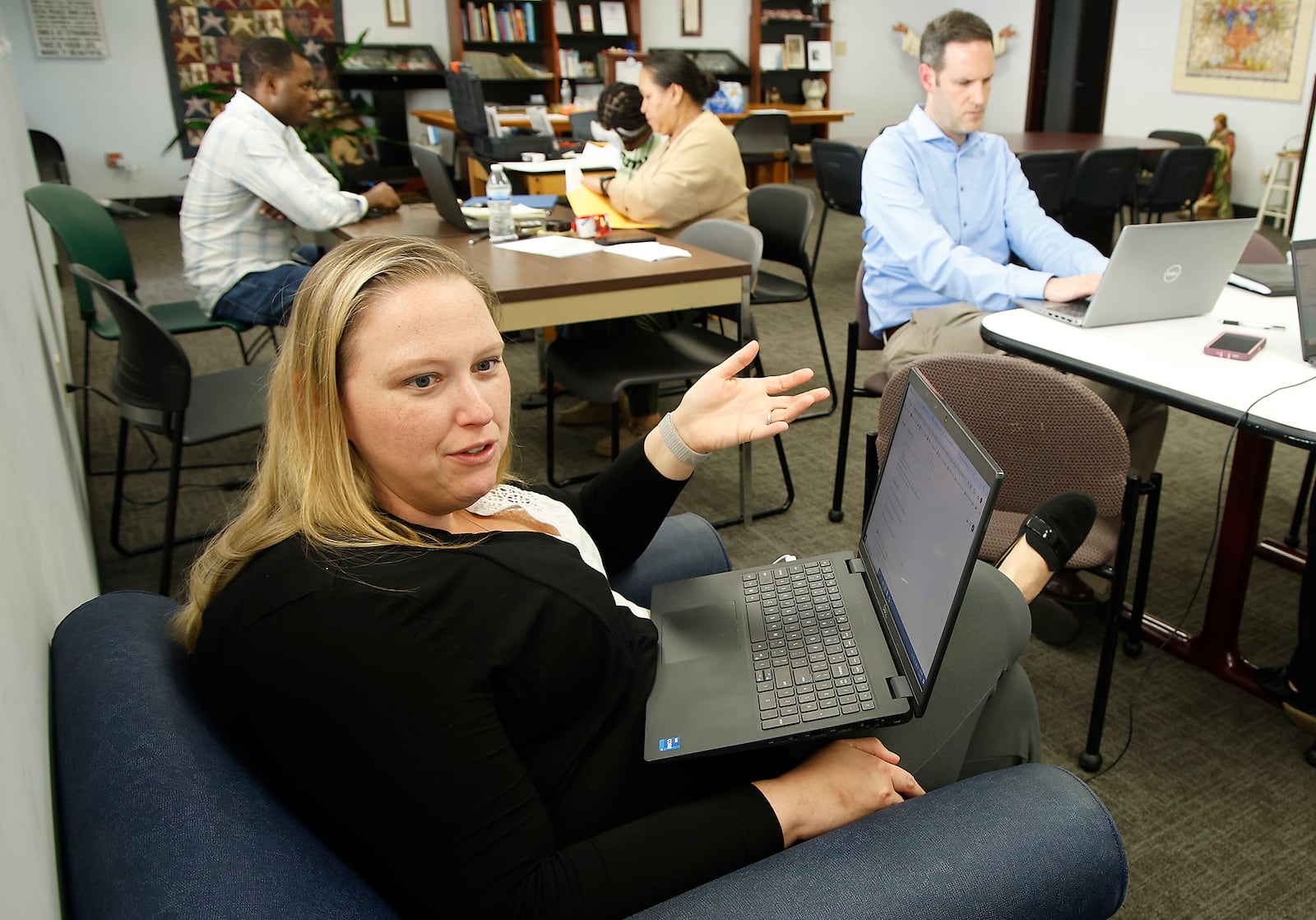 Katie Kersh, senior attorney at Advocates for Basic Legal Equality, talks about President Biden's recent limitations placed on asylum seekers Tuesday, June 4, 2024 at the St. Vincent de Paul Community Center. BILL LACKEY/STAFF