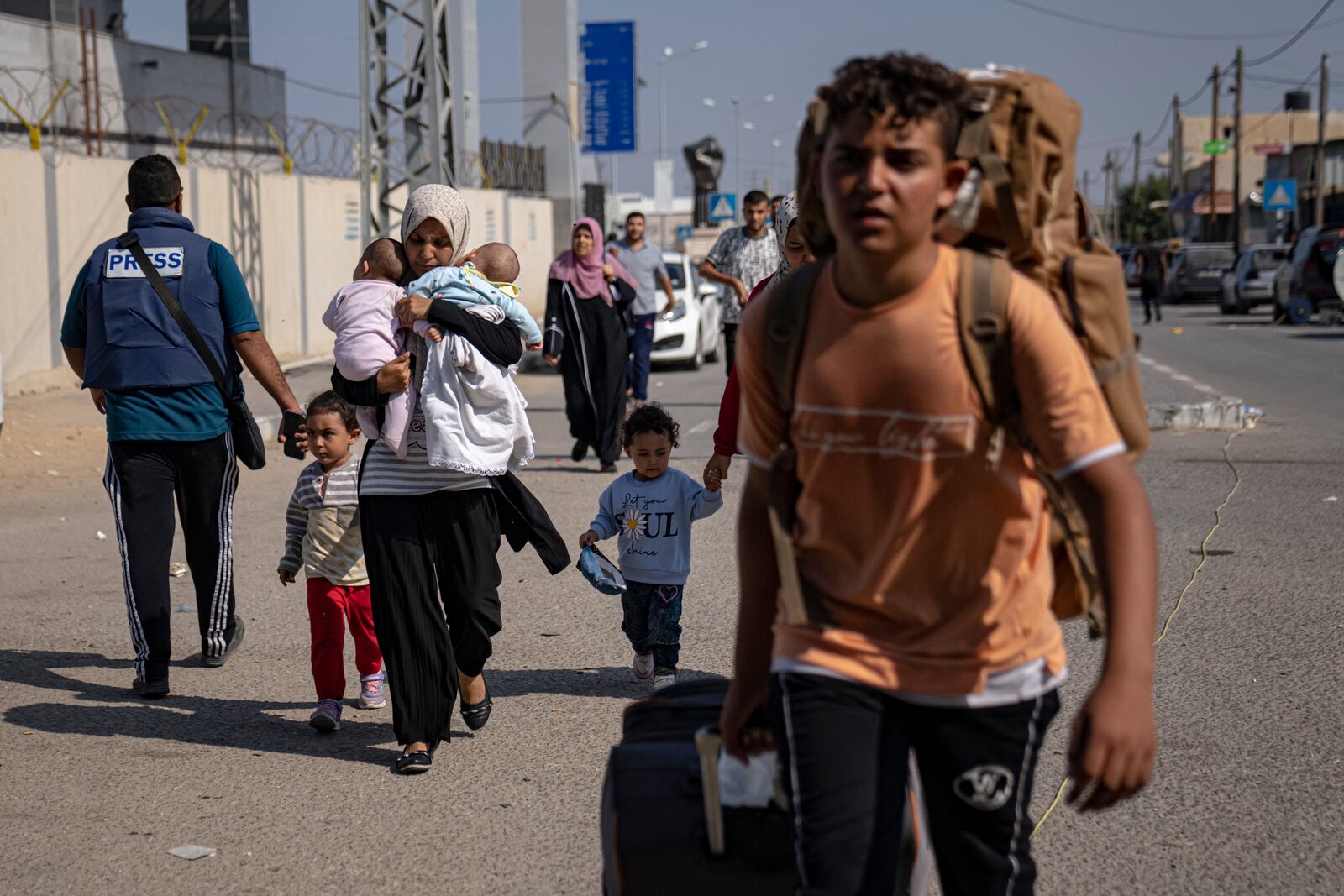 FILE - Palestinians arrive at Rafah, the border crossing between the Gaza Strip and Egypt, Nov. 1, 2023. (AP Photo/Fatima Shbair, File)