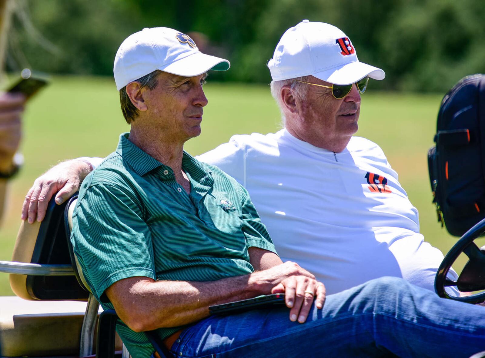 Cincinnati Bengals owner Mike Brown, right, and Cris Collinsworth watch practice Tuesday, June 6 on the practice fields next to Paul Brown Stadium in Cincinnati. NICK GRAHAM/STAFF