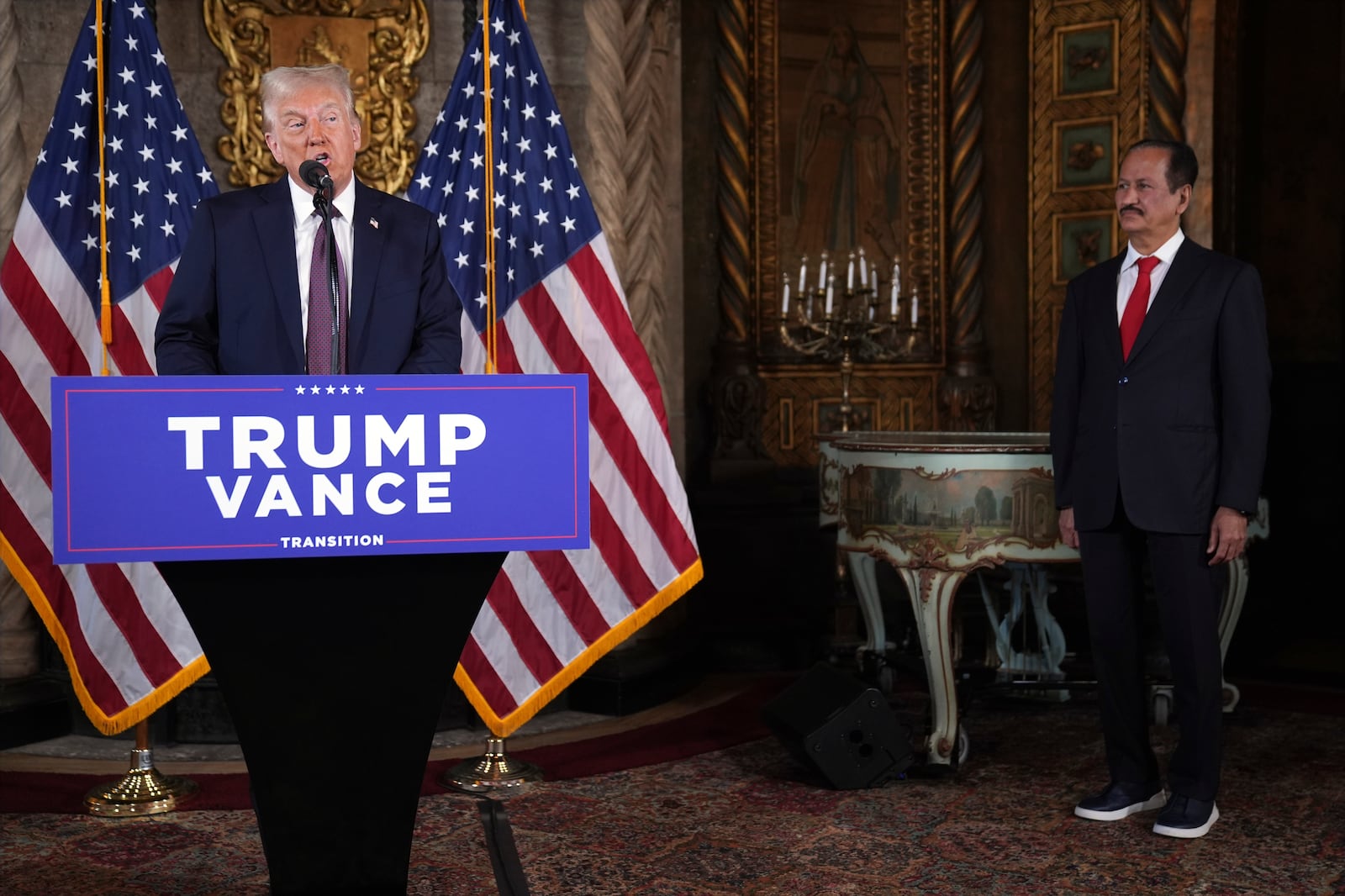 President-elect Donald Trump speaks as Hussain Sajwani, CEO of DAMAC Properties, listens during a news conference at Mar-a-Lago, Tuesday, Jan. 7, 2024, in Palm Beach, Fla. (AP Photo/Evan Vucci)