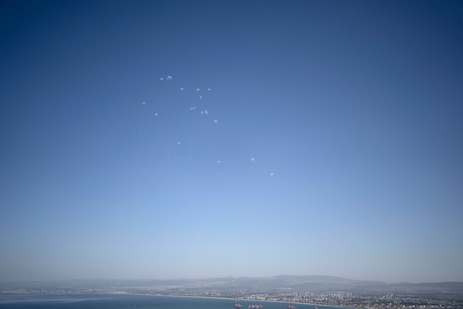 Projectiles fired from Lebanon are intercepted over Haifa, Israel, Wednesday, Oct. 23, 2024. (AP Photo/Maya Alleruzzo)