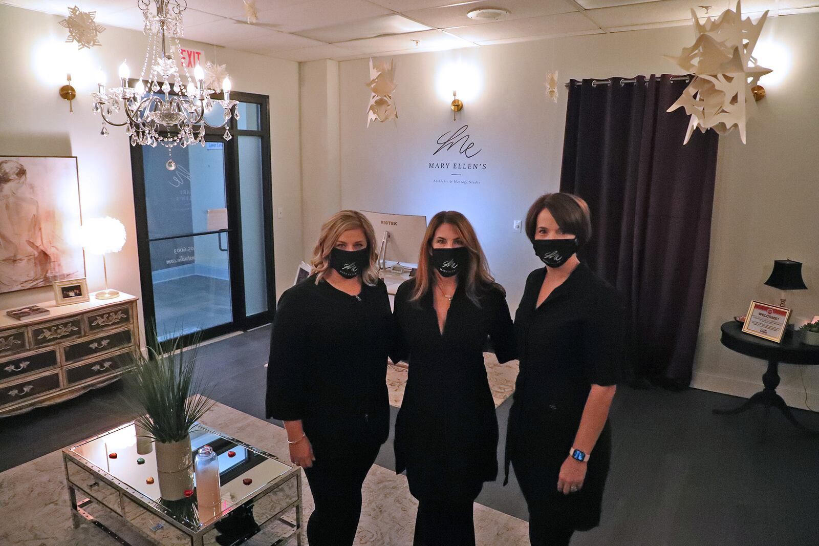 Cheryl Koelsch, center, owner of Mary Ellen's Studio, with Melissa Windle, left, and Betsy Yirak is the receptions area of the studio. BILL LACKEY/STAFF