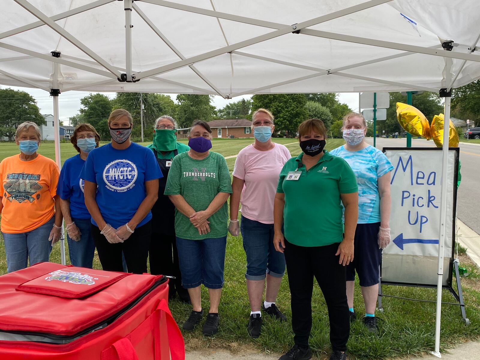 Kathie Brown, Sondra Davis, Shane Lehman, Dee Jones, Linda Hoover, Ronda Henry and Amy Herrurth, staff at Northmont City Schools prepare to distribute meals to students at Northmoor Elementary School. CONTRIBUTED