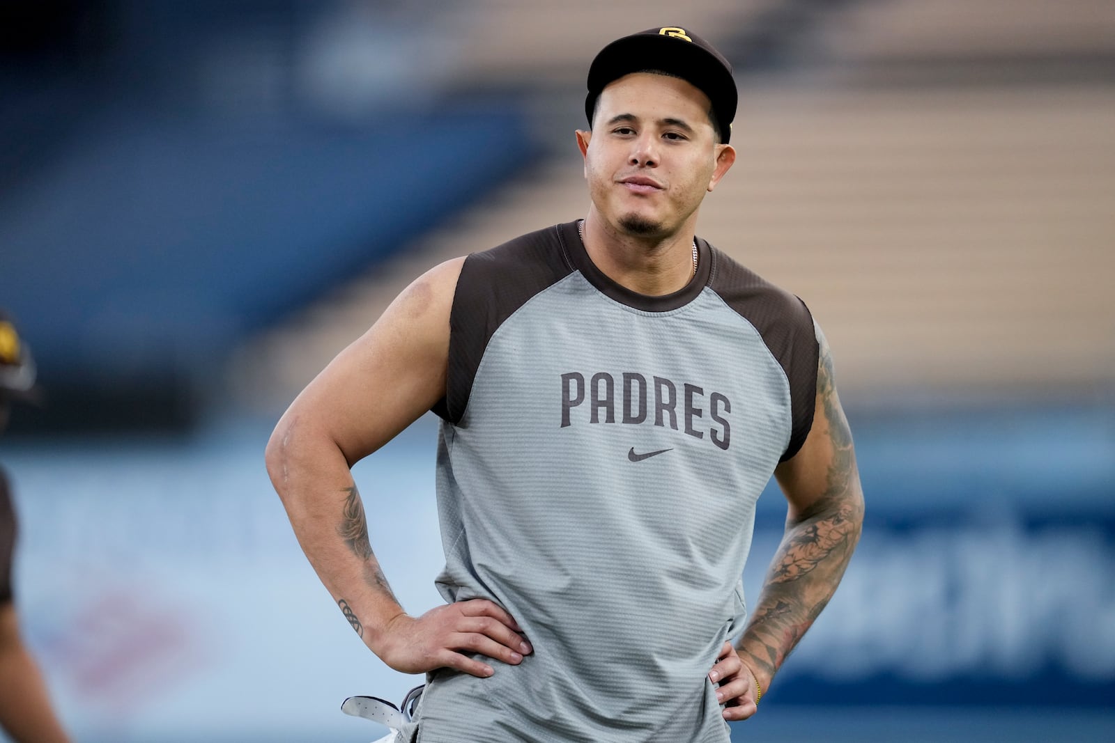 San Diego Padres' Manny Machado stands on the field during practice ahead of Game 5 of a baseball National League Division Series against the Los Angeles Dodgers, Thursday, Oct. 10, 2024, in Los Angeles. (AP Photo/Ashley Landis)