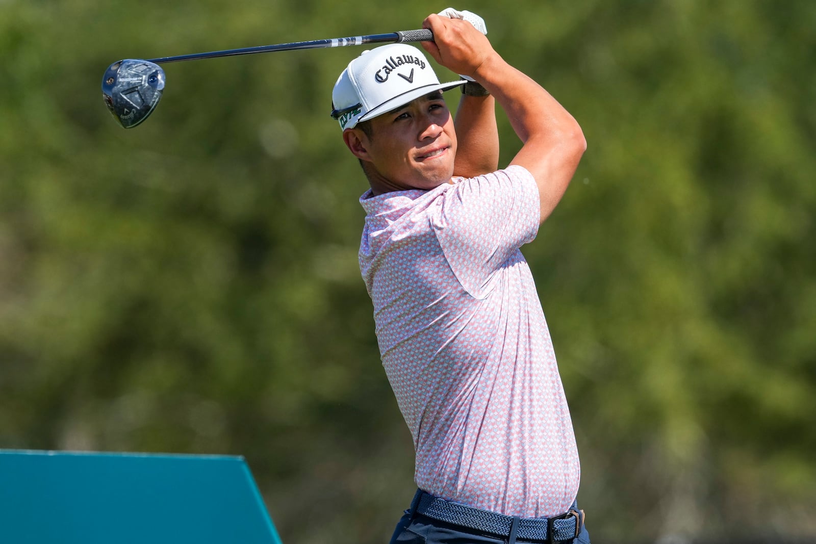 Isaiah Salinda, of the United States, watches his tee shot on the second hole during the final round of the Mexico Open golf tournament in Puerto Vallarta, Mexico, Sunday, Feb. 23, 2025. (AP Photo/Fernando Llano)