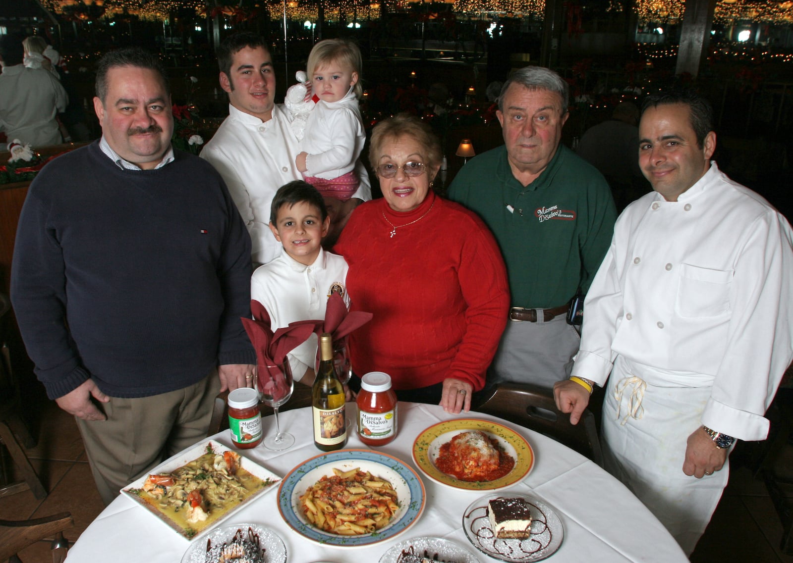 The DiSalvo family pictured in 2005: (from left) Nick, Andrew holding Abigail, 1,  Vincenzo, 7, Elena "Mamma",  "Papa" Rinaldo Sr. and Roberto are among the family members who run the Kettering establishment. PHOTO BY JAN UNDERWOOD