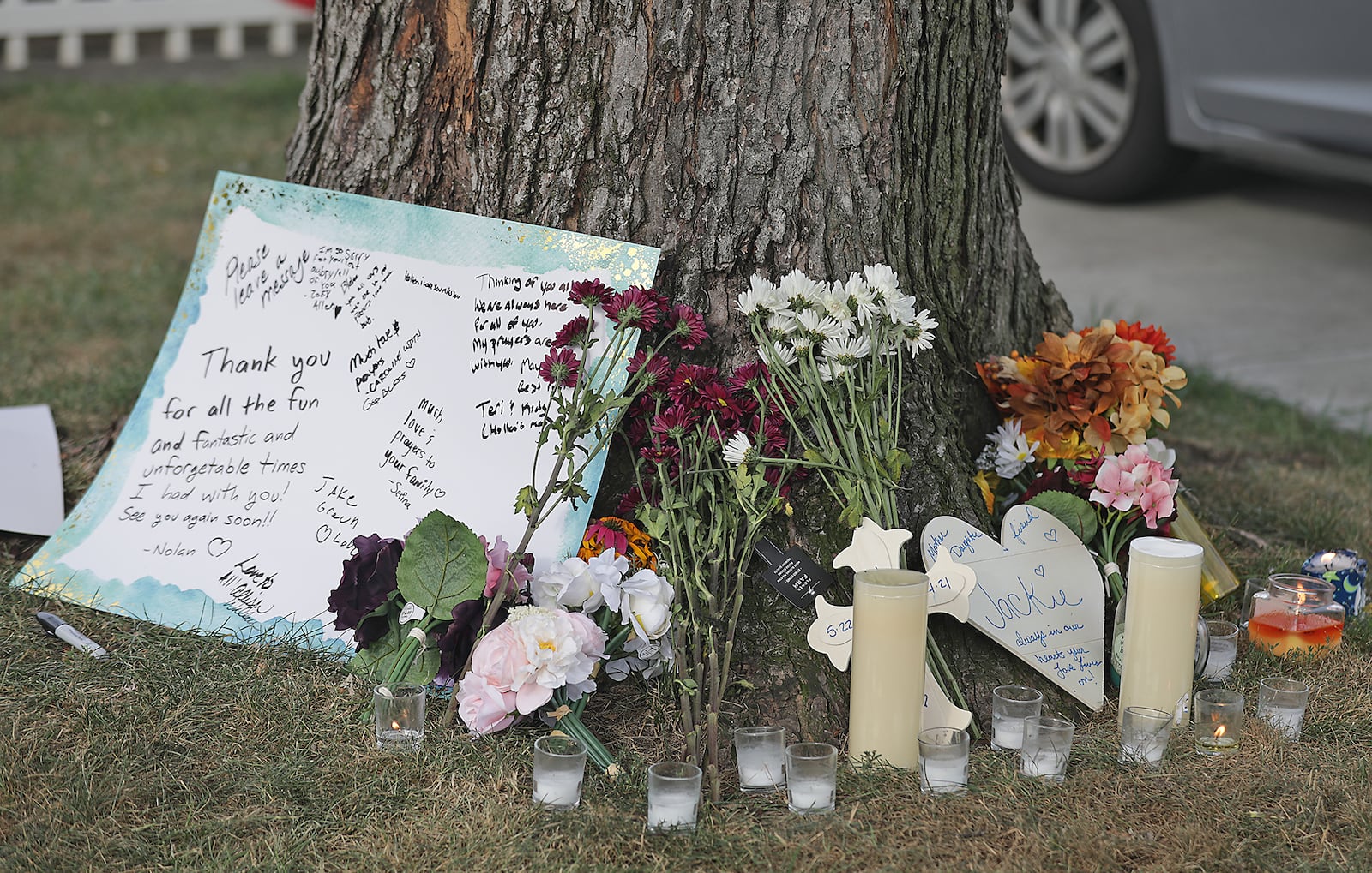 A memorial has been erected around a tree in the front yard at 141 Weinland Street in Park Layne for Jacqueline Coles. BILL LACKEY/STAFF