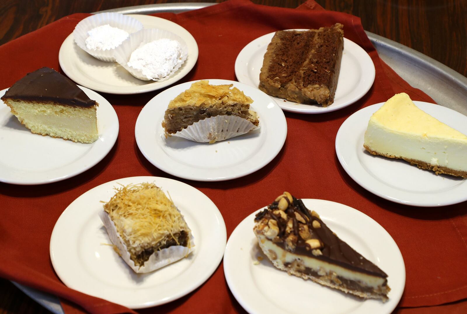 The desert tray at Linardos Villa includes baklava, cheesecake and Snickers pie. BILL LACKEY/STAFF