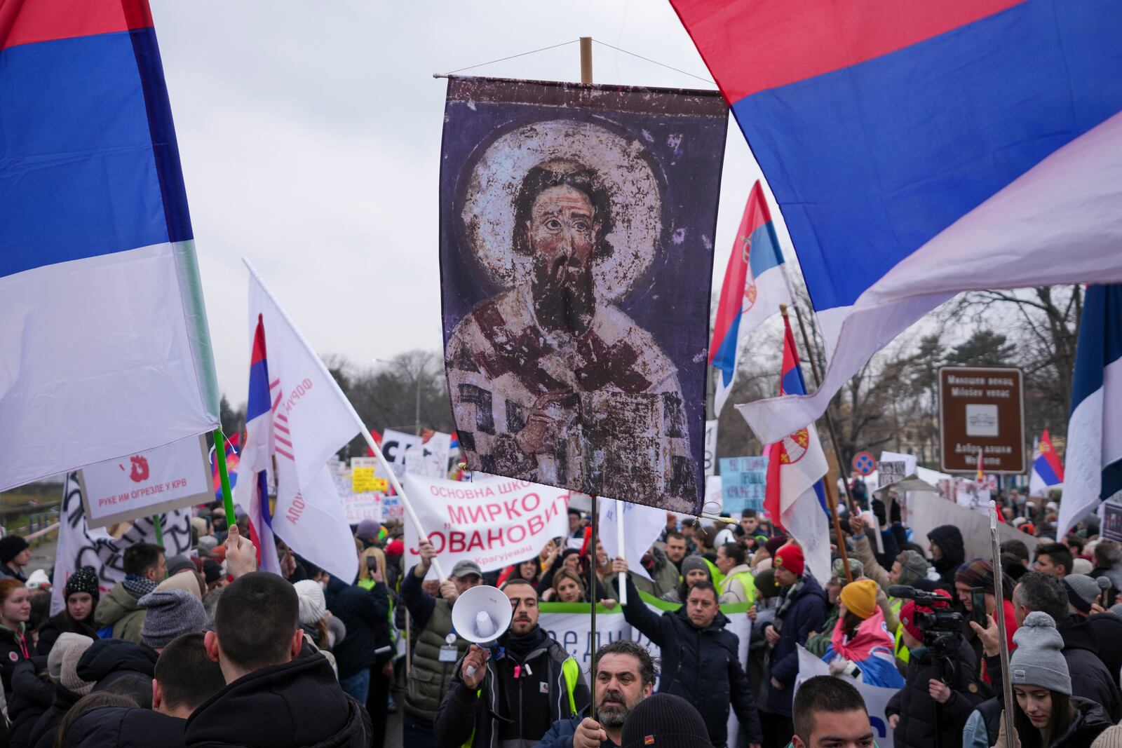 People attend a protest triggered after a concrete canopy on a railway station in the northern city of Novi Sad collapsed on Nov. 1, 2024 killed 15 people, in Kragujevac, Serbia, Saturday, Feb. 15, 2025. (AP Photo/Darko Vojinovic)