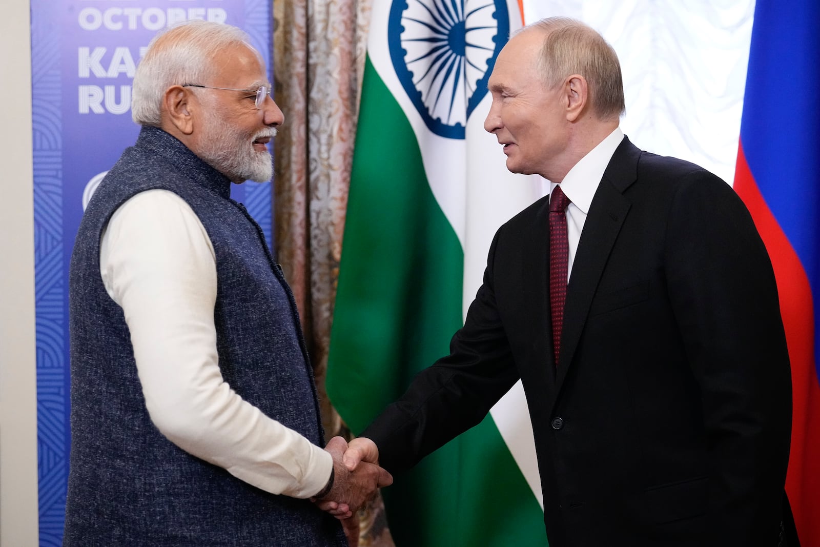 Russian President Vladimir Putin, right, and Indian Prime Minister Narendra Modi shake hands during their meeting on the sidelines of BRICS Summit at Kazan Kremlin in Kazan, Russia, Tuesday, Oct. 22, 2024. (AP Photo/Alexander Zemlianichenko, Pool)