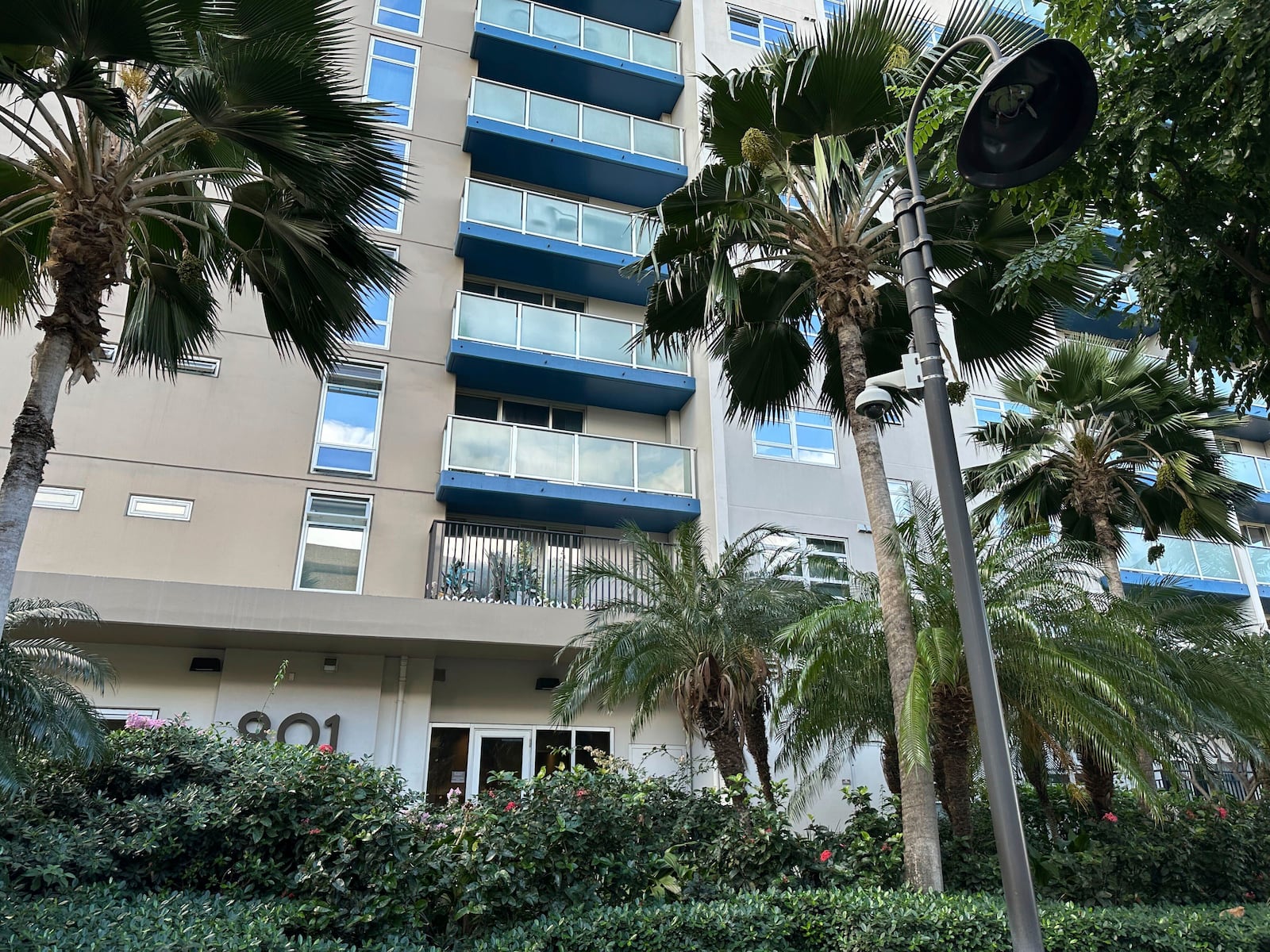 This photo shows the exterior of the apartment complex where the UnitedHealthcare CEO shooting suspect lived in Honolulu, Monday, Dec. 9, 2024. (AP Photo/Jennifer Kelleher)