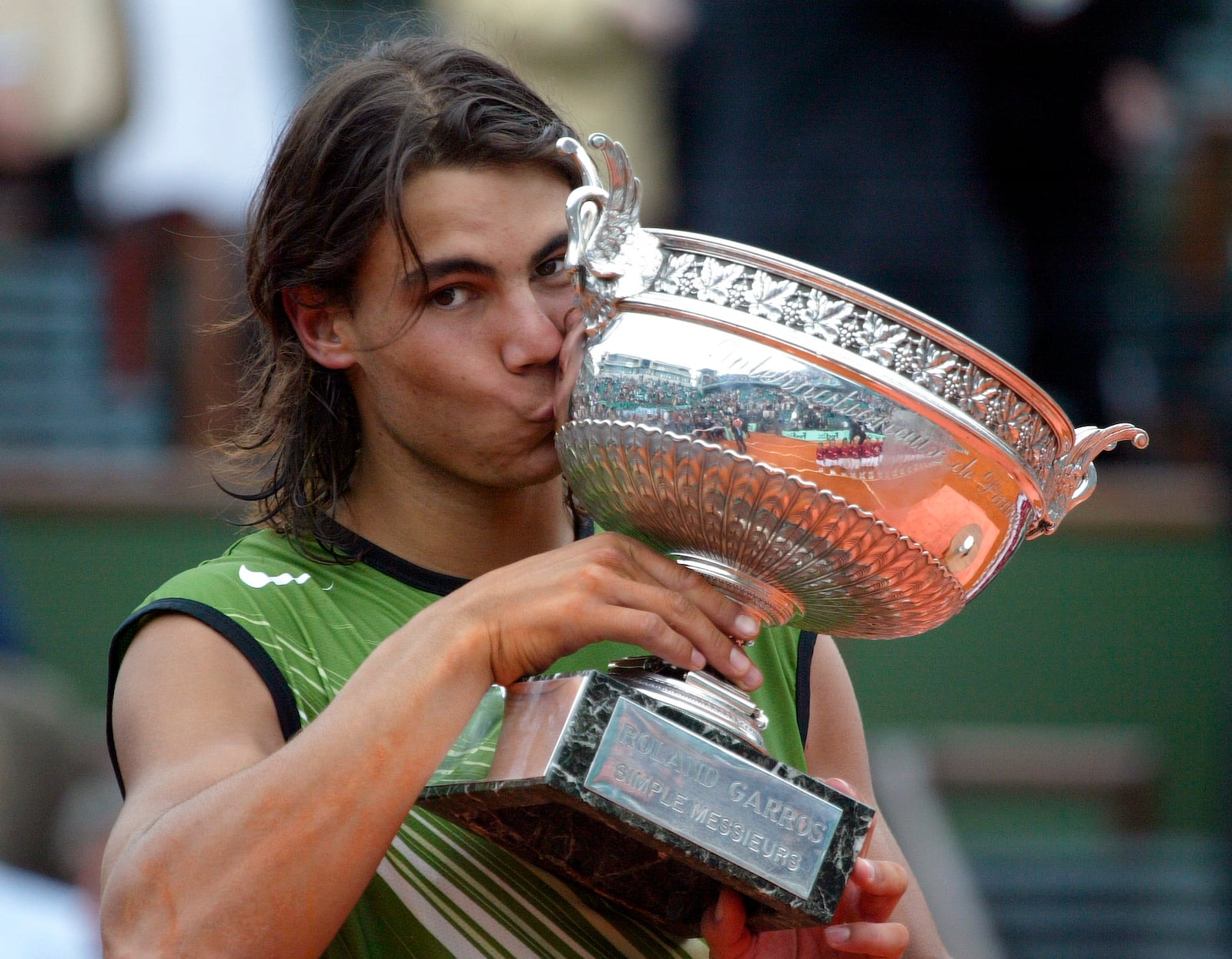 FILE - Spain's Rafael Nadal kisses the trophy after defeating Argentina's Mariano Puerta during their final of the French Open tennis tournament, at the Roland Garros stadium, Sunday, June 5, 2005 in Paris. (AP Photo/Lionel Cironneau, File)