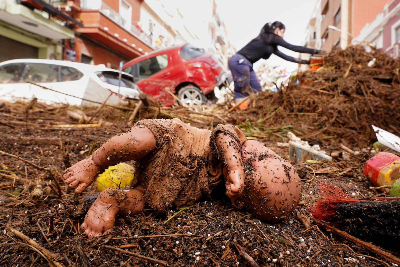 A dummy is photographed after being swept away by floods in Valencia, Spain, Wednesday, Oct. 30, 2024. (AP Photo/Alberto Saiz)