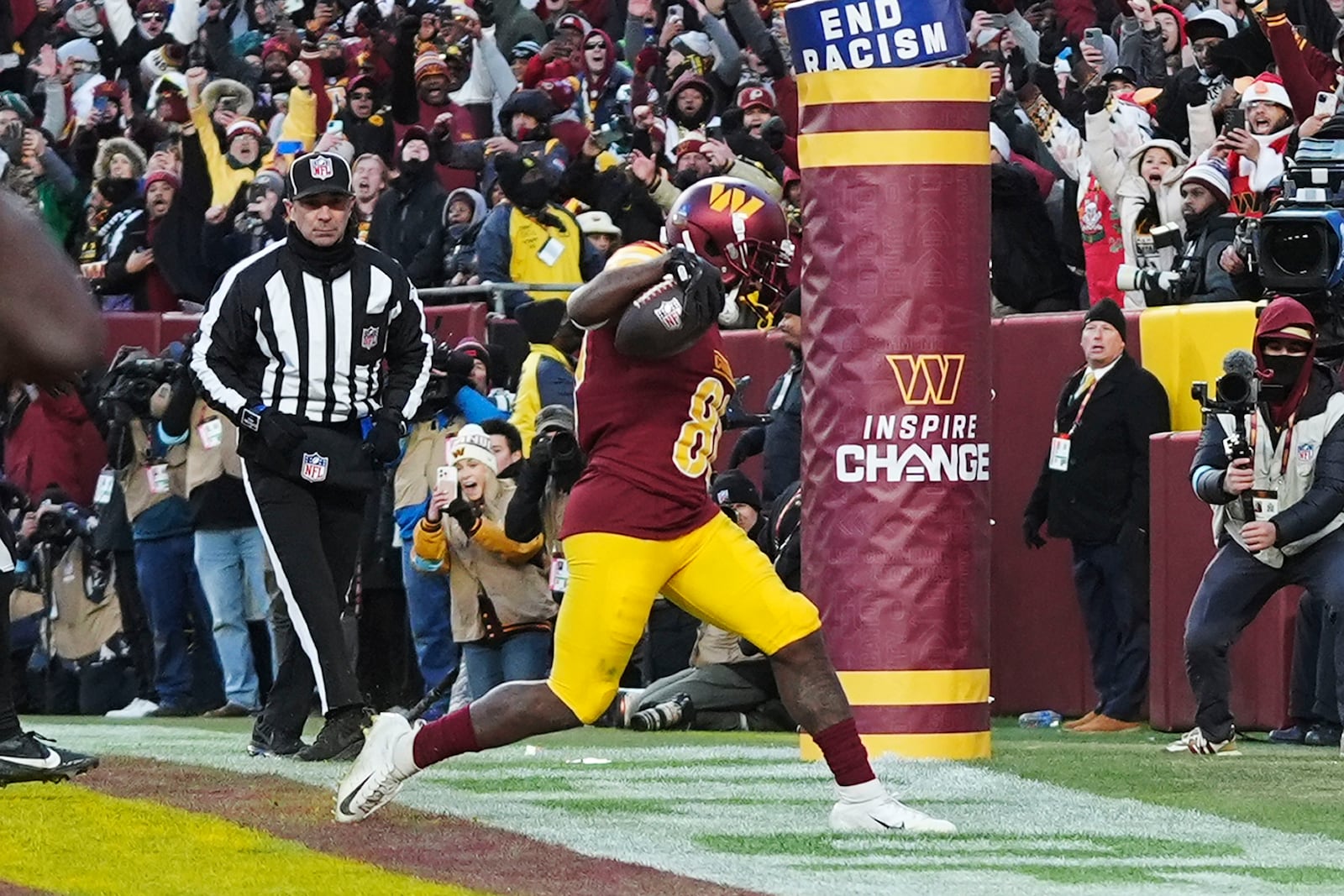 Washington Commanders wide receiver Jamison Crowder (80) scoring a touchdown against the Philadelphia Eagles during the second half of an NFL football game, Sunday, Dec. 22, 2024, in Landover, Md. (AP Photo/Stephanie Scarbrough)