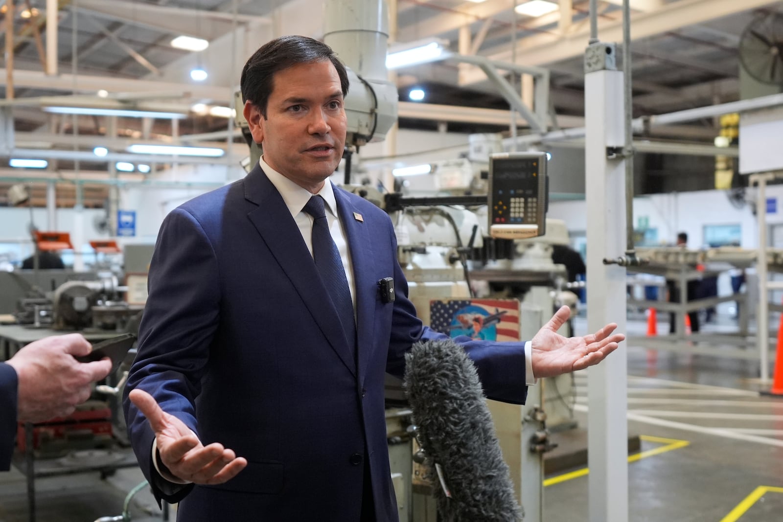 U.S. Secretary of State Marco Rubio speaks to journalists during a visit to aircraft maintenance firm Aeroman in San Luis Talpa, El Salvador, Monday, Feb. 3, 2025. (AP Photo/Mark Schiefelbein, Pool)