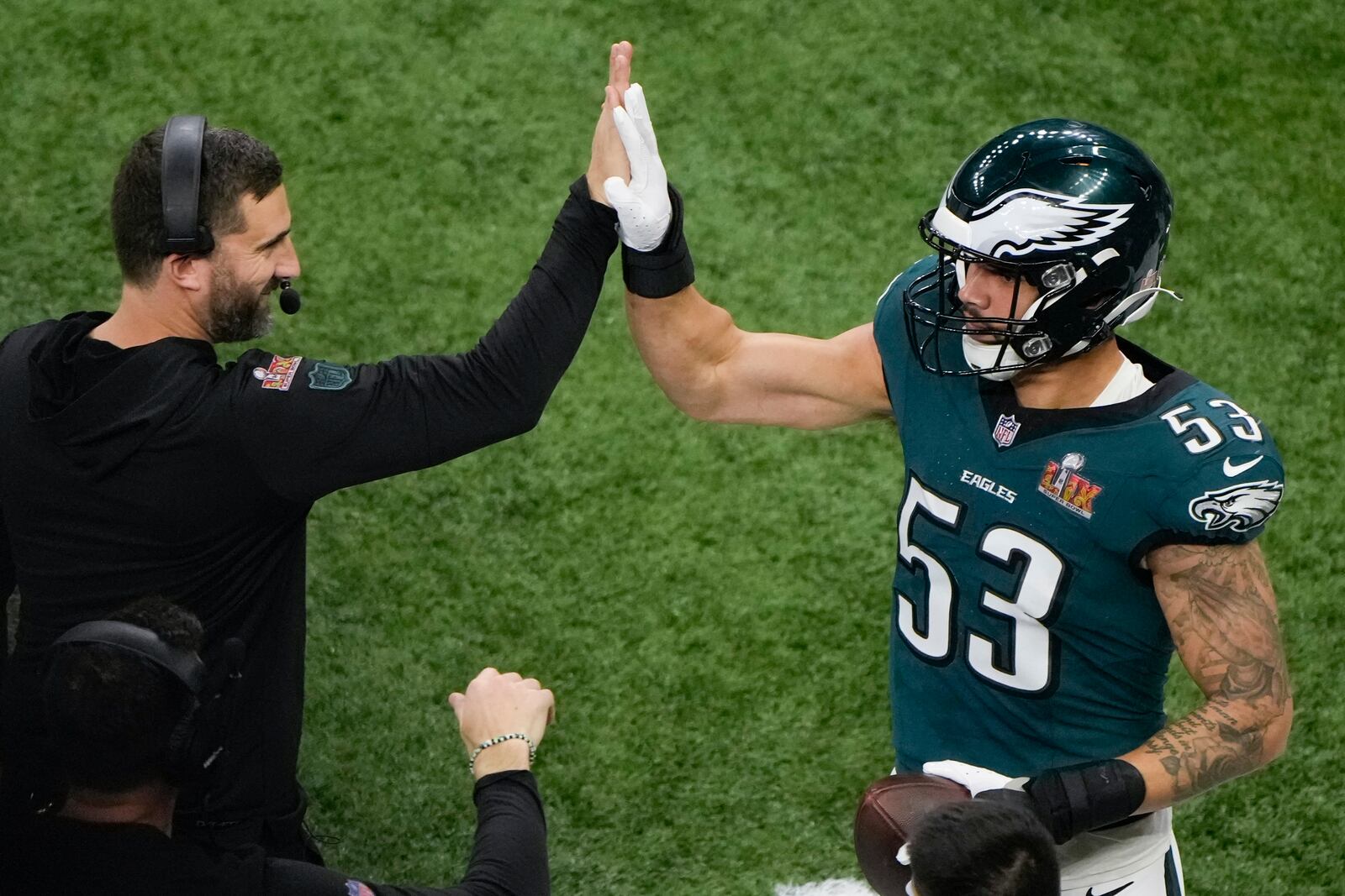 Philadelphia Eagles linebacker Zack Baun (53) celebrates after an interception with head coach Nick Sirianni during the first half of the NFL Super Bowl 59 football game against the Kansas City Chiefs, Sunday, Feb. 9, 2025, in New Orleans. (AP Photo/Charlie Riedel)