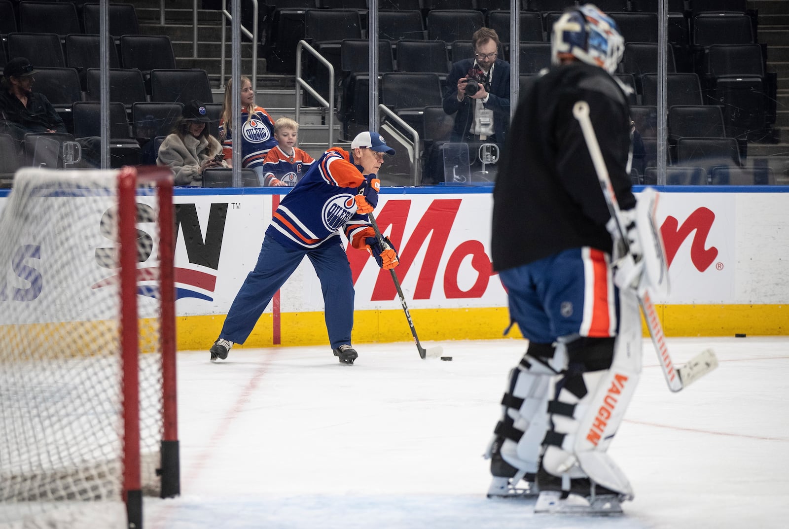 Canadian Prime Minister Mark Carney skates with the Edmonton Oilers NHL hockey team during a visit to Edmonton, Alberta, Thursday, March 20, 2025. (Jason Franson/The Canadian Press via AP)