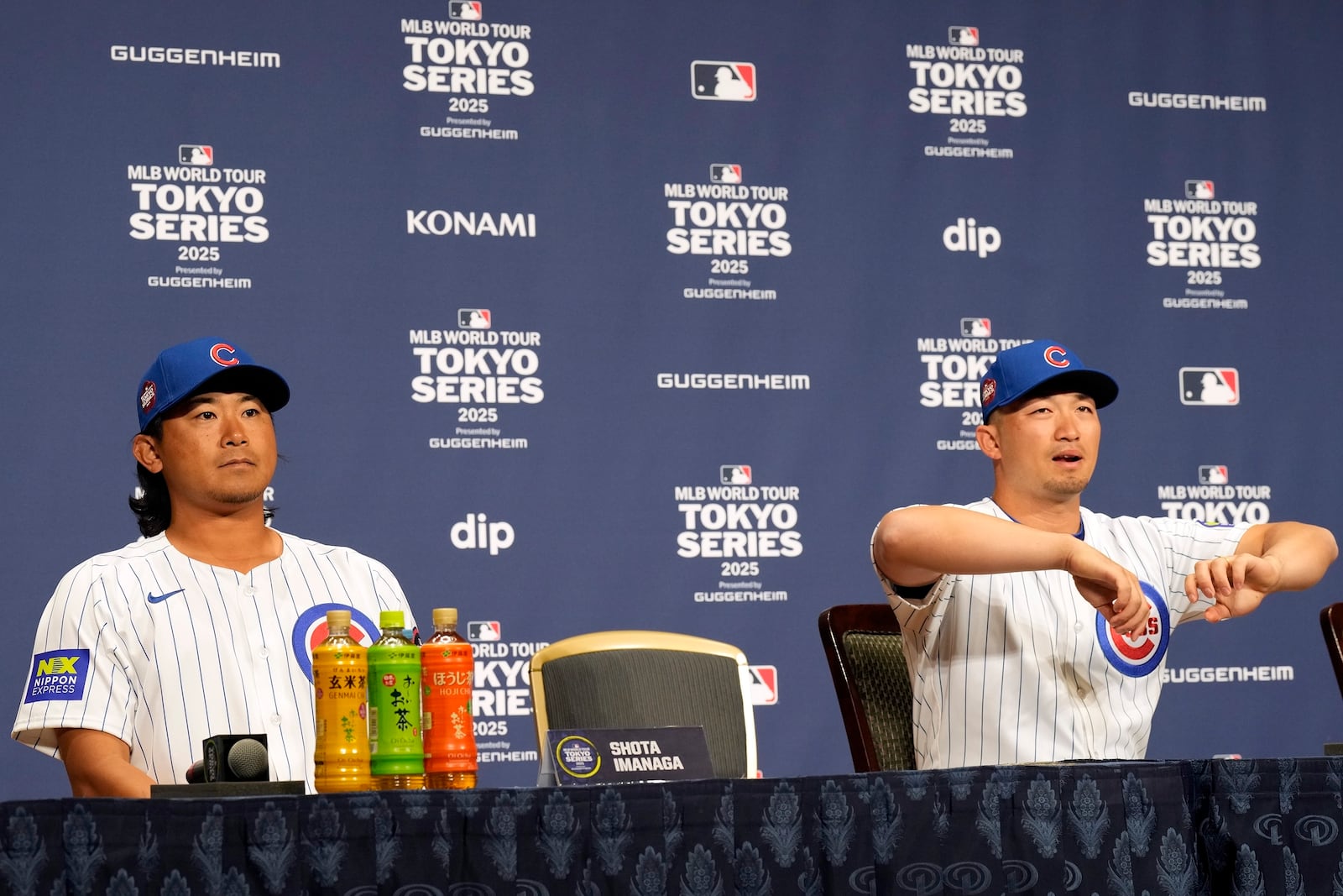 Seiya Suzuki, right, and Shota Imanaga, left, of the Chicago Cubs attend the official Press conference Friday, March 14, 2025, in Tokyo, as the Cubs play their MLB opening games against the Los Angeles Dodgers at Tokyo Dome next week. (AP Photo/Eugene Hoshiko)