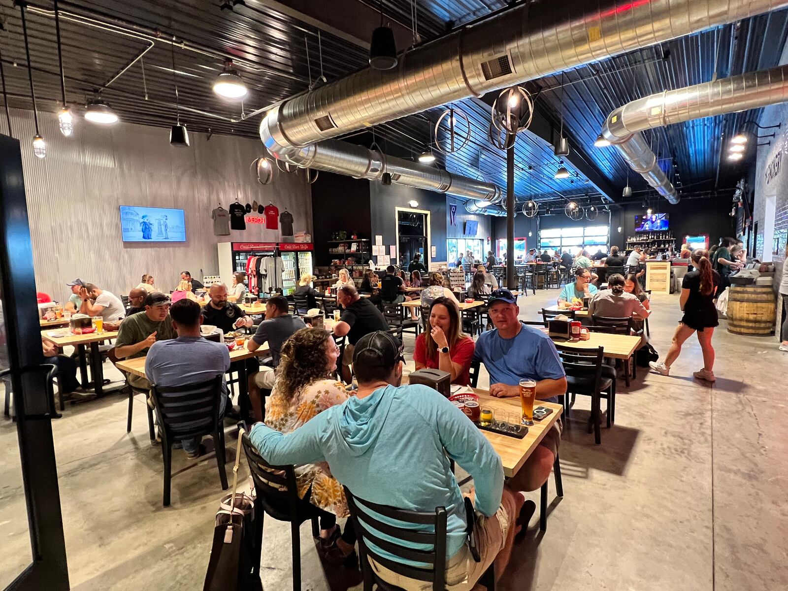 Warped Wing Brewery & Smokery in Huber Heights is an open industrial space with plenty of natural light. ALEXIS LARSEN/CONTRIBUTOR