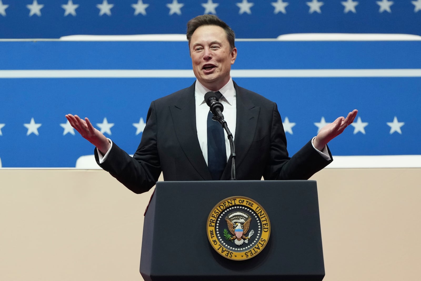 Elon Musk speaks at an indoor Presidential Inauguration parade event in Washington, Monday, Jan. 20, 2025. (AP Photo/Matt Rourke)