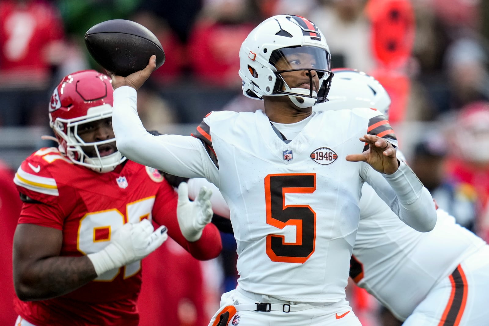 Cleveland Browns quarterback Jameis Winston (5) passes under pressure against the Kansas City Chiefs during the first half of an NFL football game, Sunday, Dec. 15, 2024, in Cleveland. (AP Photo/Sue Ogrocki)