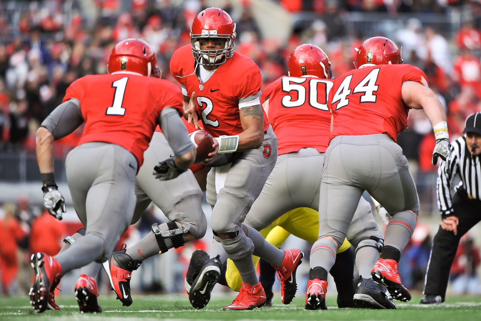 COLUMBUS, OH - NOVEMBER 27:  Quarterback Terrelle Pryor #2 of the Ohio State Buckeyes hands off against the Michigan Wolverines at Ohio Stadium on November 27, 2010 in Columbus, Ohio.  (Photo by Jamie Sabau/Getty Images)