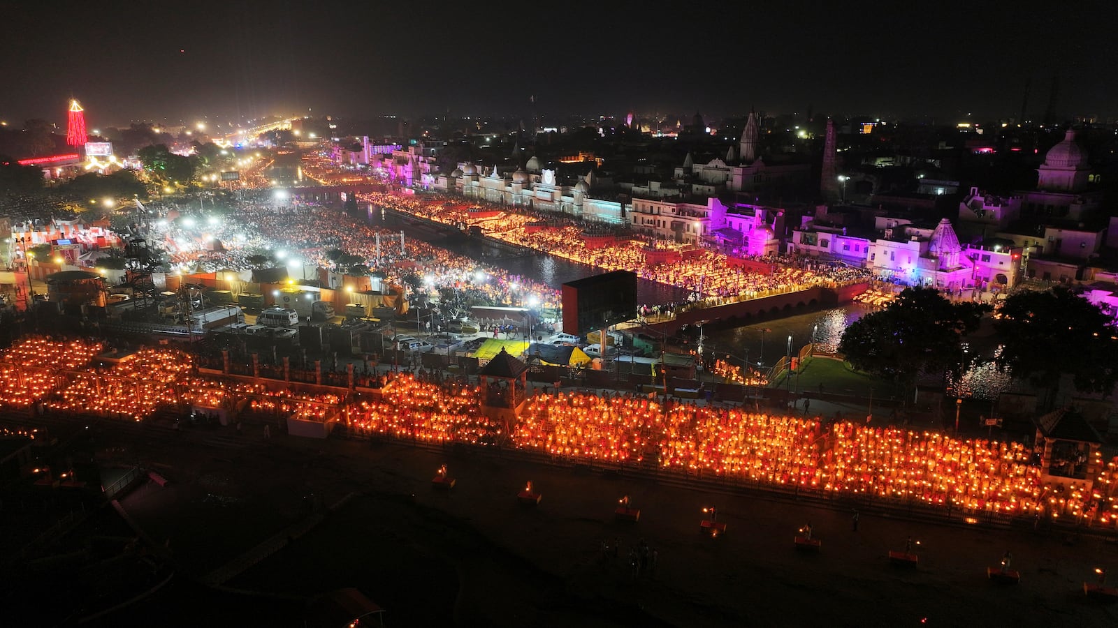 A record 2.51 million earthen oil lamps are lit along the Saryu river during Deepotsav celebrations on the eve of Diwali, creating a new Guinness World Record, in Ayodhya, India, Wednesday, Oct. 30, 2024. (AP Photo/Rajesh Kumar Singh)