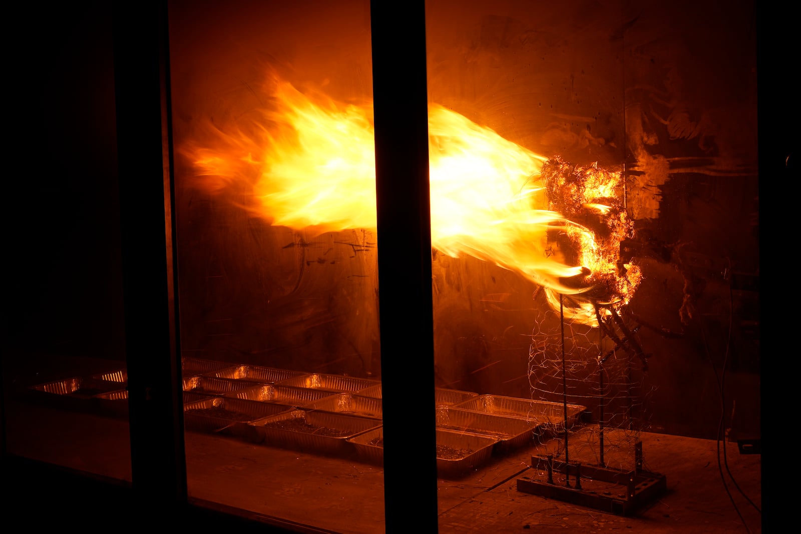 Brush burns in a wind tunnel in lab at Worcester Polytechnic Institute, Wednesday, Jan. 15, 2025, in Worcester, Mass. (AP Photo/Robert F. Bukaty)