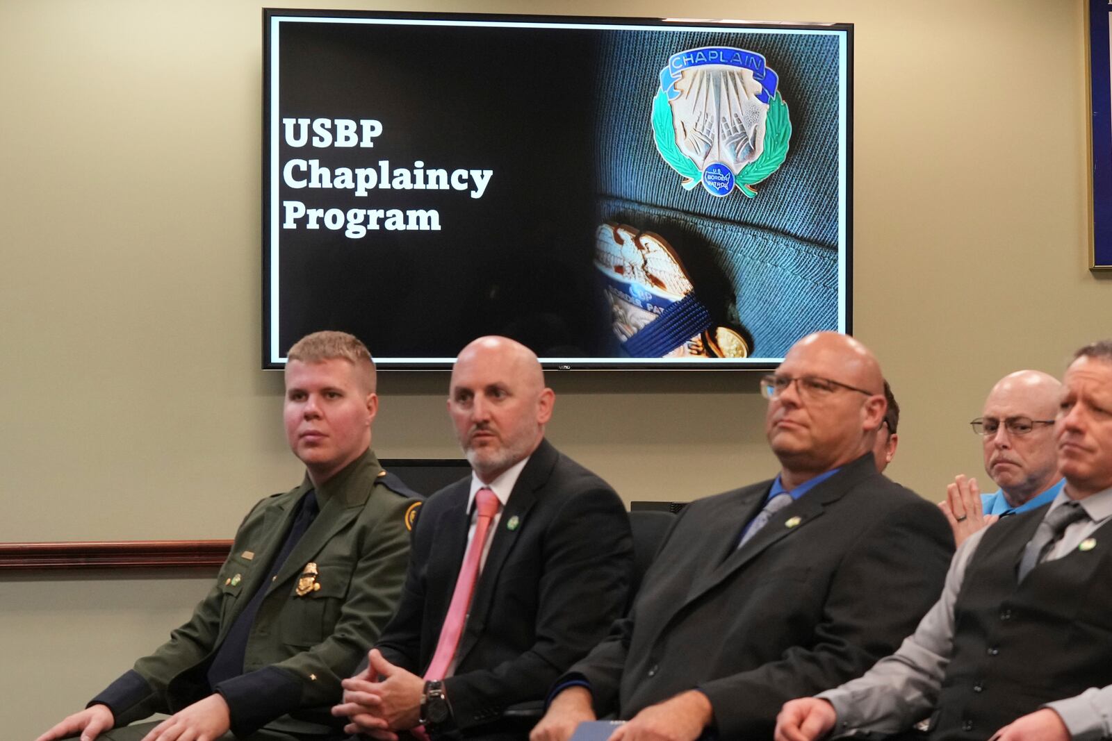 The USBP chaplaincy program class listen to remarks during their graduation, Thursday, Nov. 21, 2024, in Dania Beach, Fla. (AP Photo/Marta Lavandier)