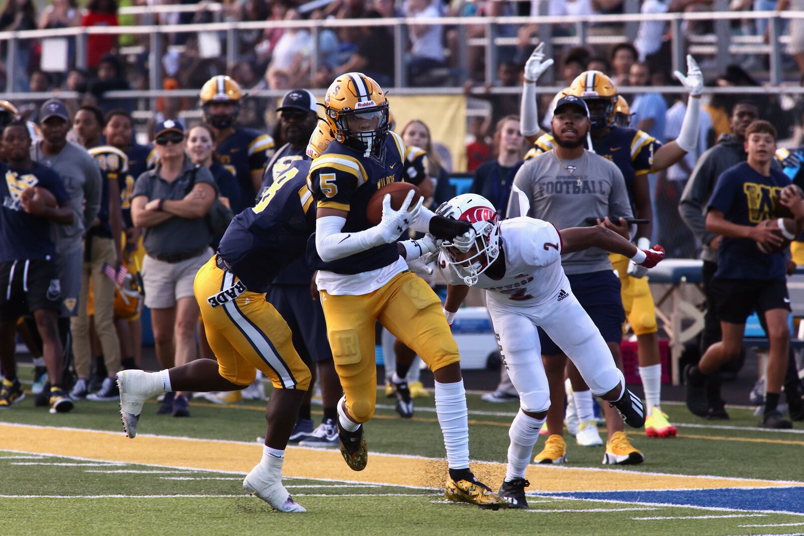 Springfield's Aaron Scott returns an interception for a score against Trotwood-Madison on Friday, Sept. 2, 2022, in Springfield. David Jablonski/Staff