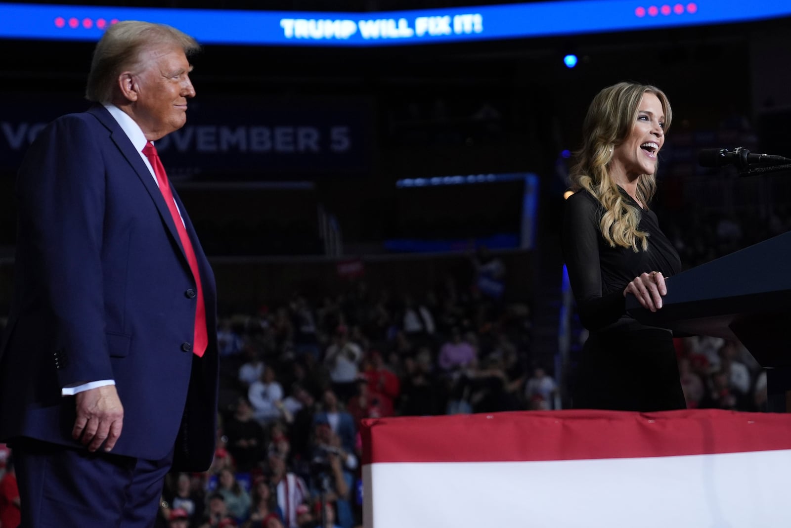 Republican presidential nominee former President Donald Trump listens as Megyn Kelly speaks at a campaign rally at PPG Paints Arena, Monday, Nov. 4, 2024, in Pittsburgh, Pa. (AP Photo/Evan Vucci)