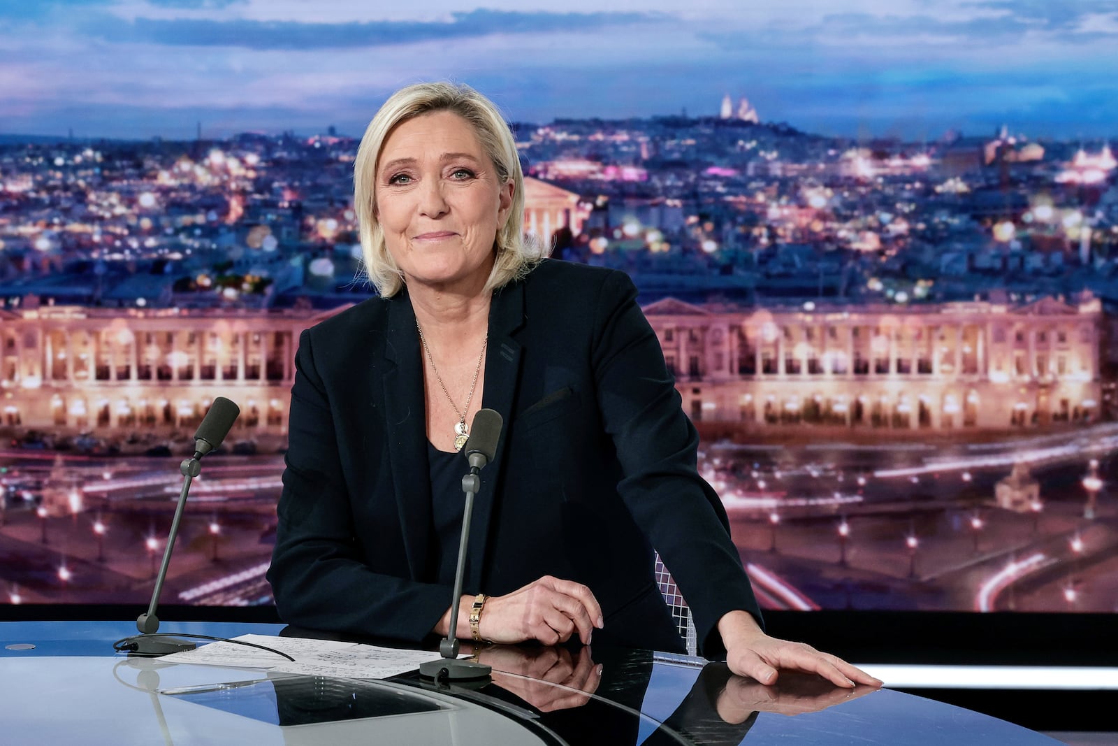 French far-right leader Marine Le Pen poses prior to an interview on French TV channel TF1, in Boulogne-Billancourt, outside Paris, Wednesday, Dec. 4, 2024 after France's far-right and left-wing lawmakers joined together to vote a no-confidence motion prompted by budget disputes that forces Prime Minister Michel Barnier to resign. (Stephane de Sakutin, Pool via AP)