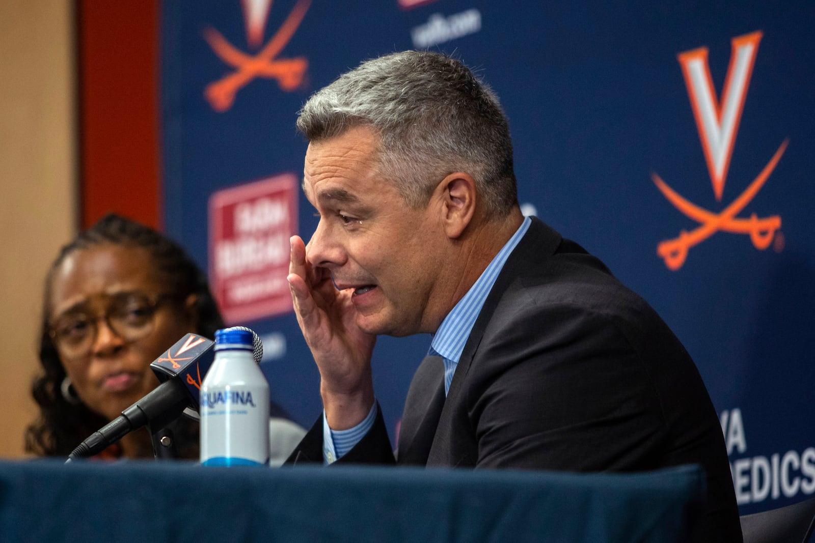 Virginia NCAA college basketball coach Tony Bennett announces his retirement as athletic director Carla Willliams looks on during a press conference in Charlottesville, Va., Friday, Oct. 18, 2024. Cal CaryThe Daily Progress via AP)