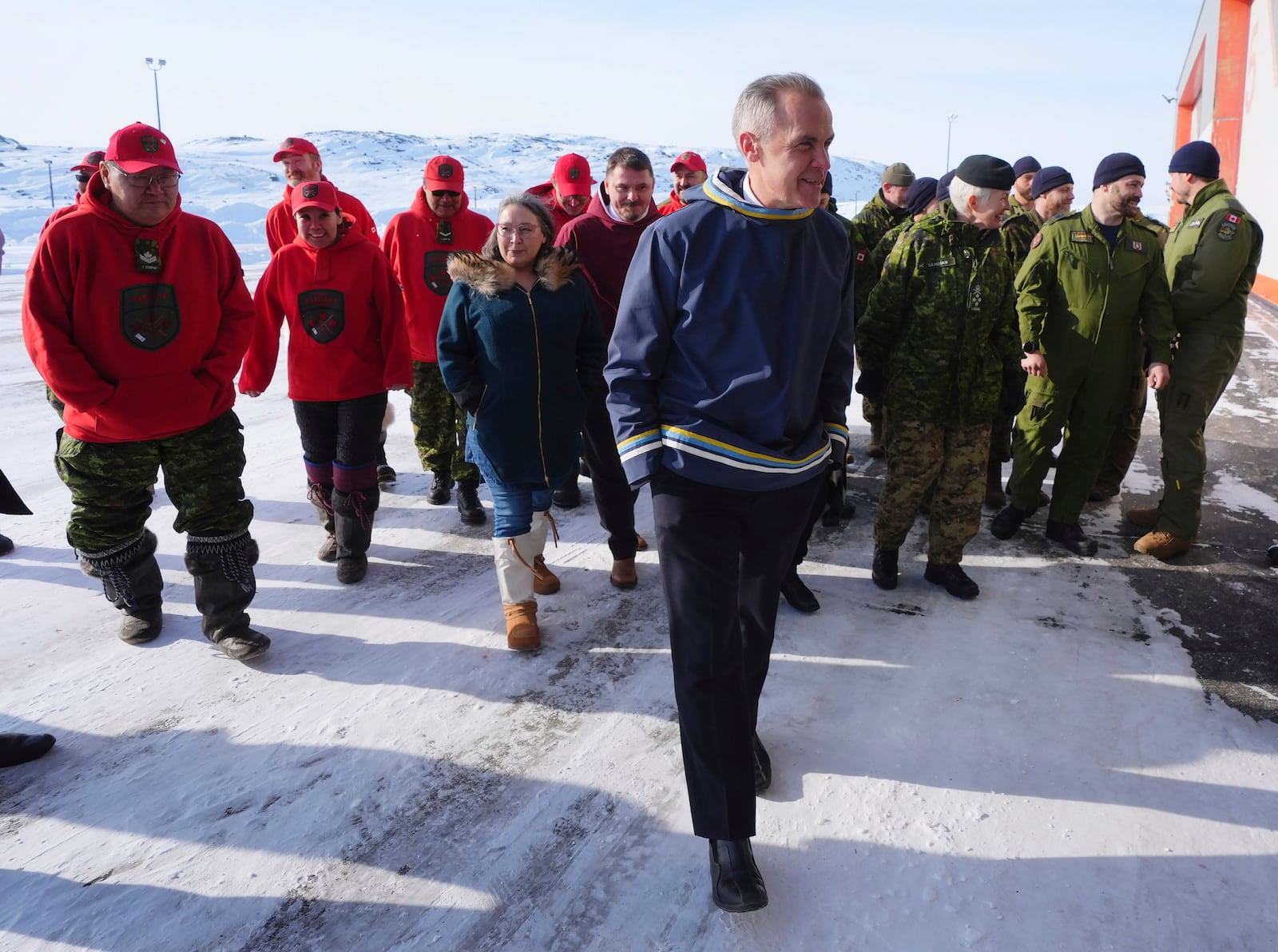 Canadian Prime Minister Mark Carney leaves a photo opportunity after making an announcement at a Canadian Armed Forces forward-operating location in Iqaluit, Nunavut, Tuesday, March 18, 2025. (Sean Kilpatrick/The Canadian Press via AP)