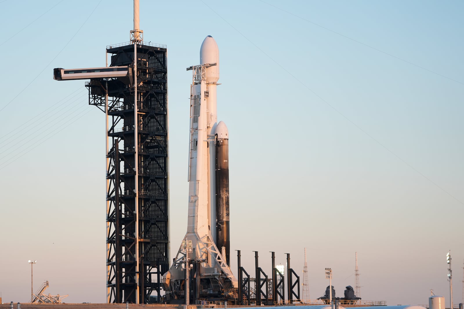 A SpaceX Falcon Heavy rocket with a NASA spacecraft bound for Jupiter stands ready for launch today on pad 39A at the Kennedy Space Center Monday, Oct. 14, 2024 in Cape Canaveral, Fla. (AP Photo/John Raoux)