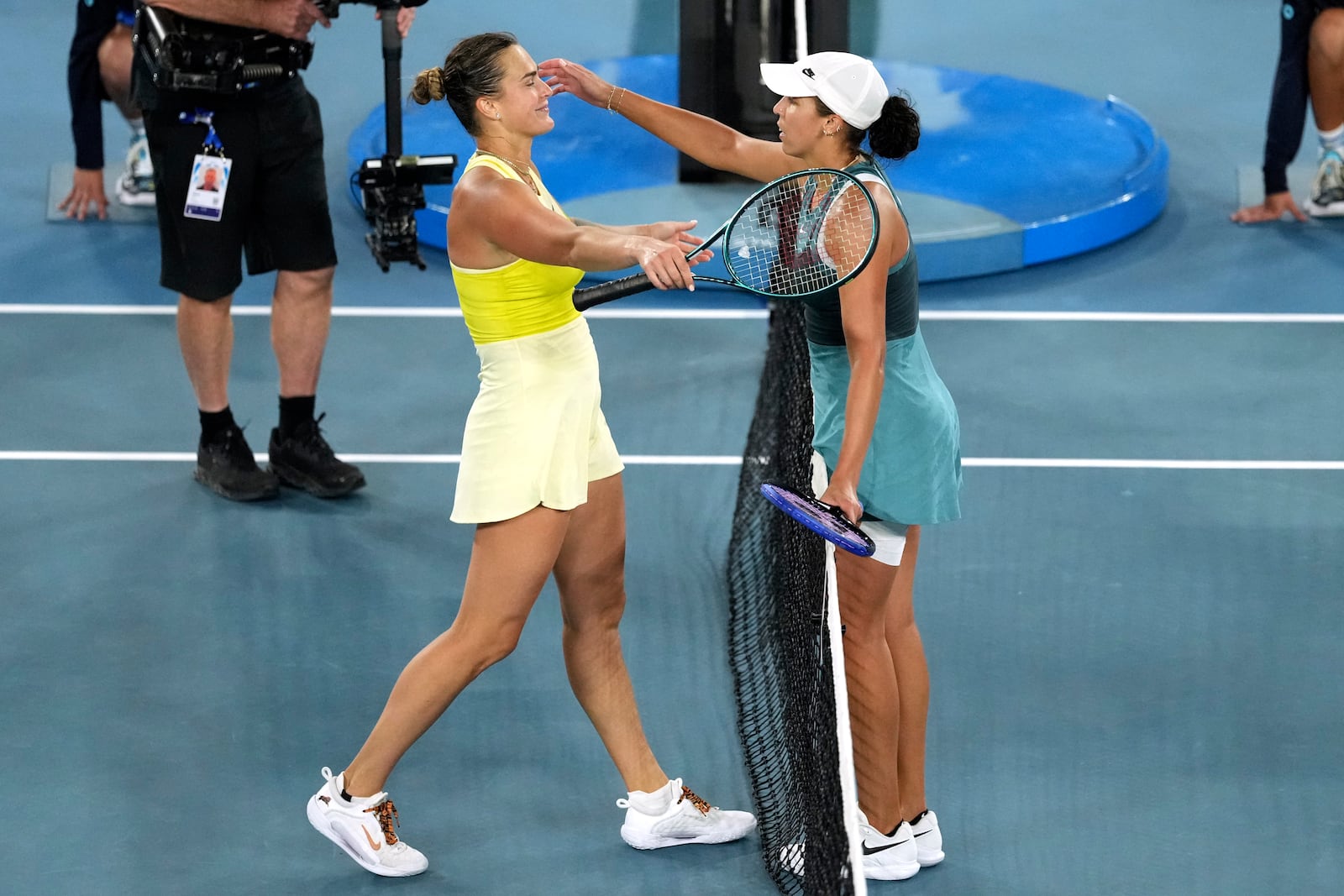 Madison Keys, right, of the U.S. is congratulated by Aryna Sabalenka of Belarus in the women's singles final at the Australian Open tennis championship in Melbourne, Australia, Saturday, Jan. 25, 2025.(AP Photo/Mark Baker)