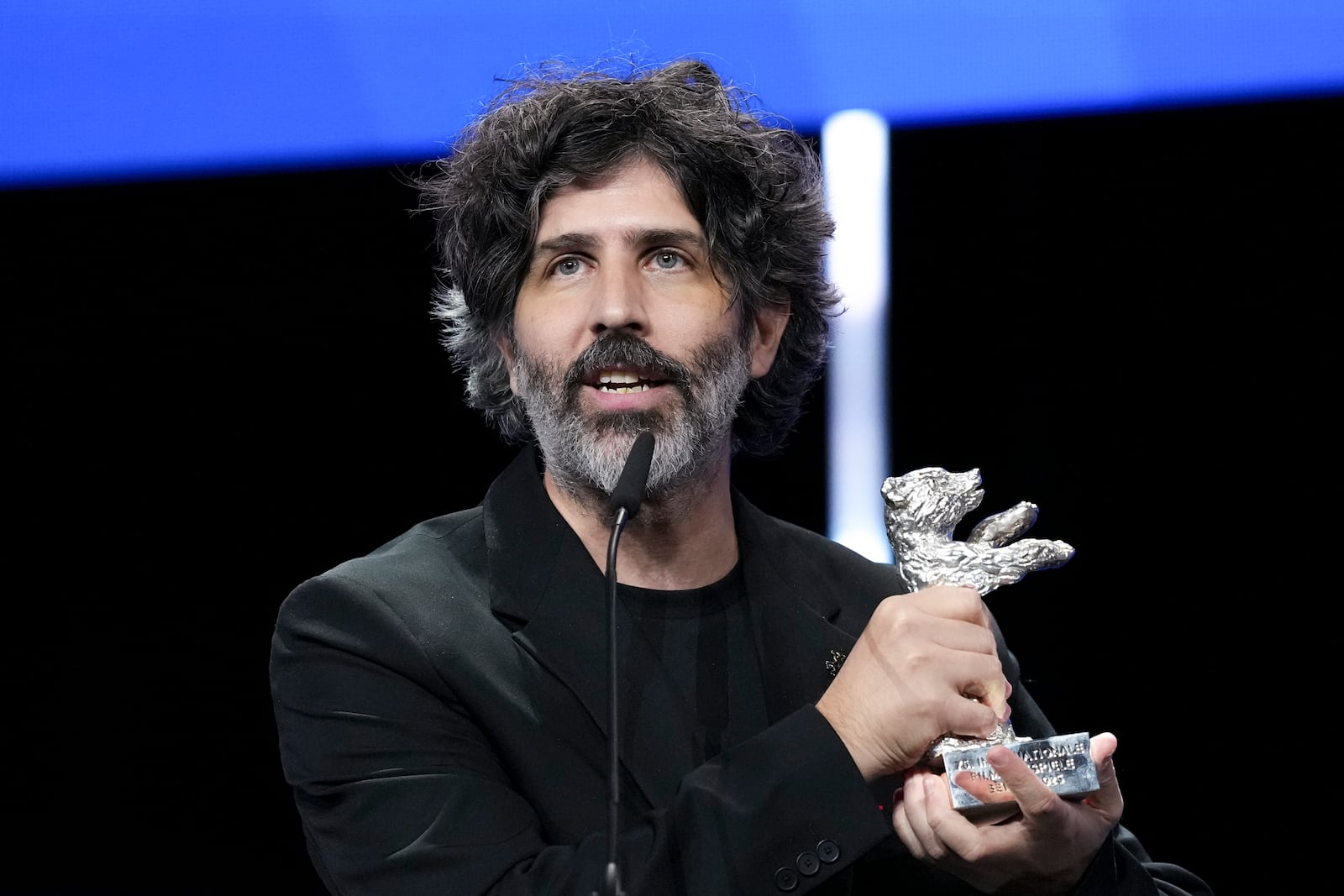 Ivan Fund accepts the Silver Bear jury prize for the film 'The Message' during the awards ceremony at the International Film Festival, Berlinale, in Berlin, Saturday, Feb. 22, 2025. (Photo by Scott A Garfitt/Invision/AP).