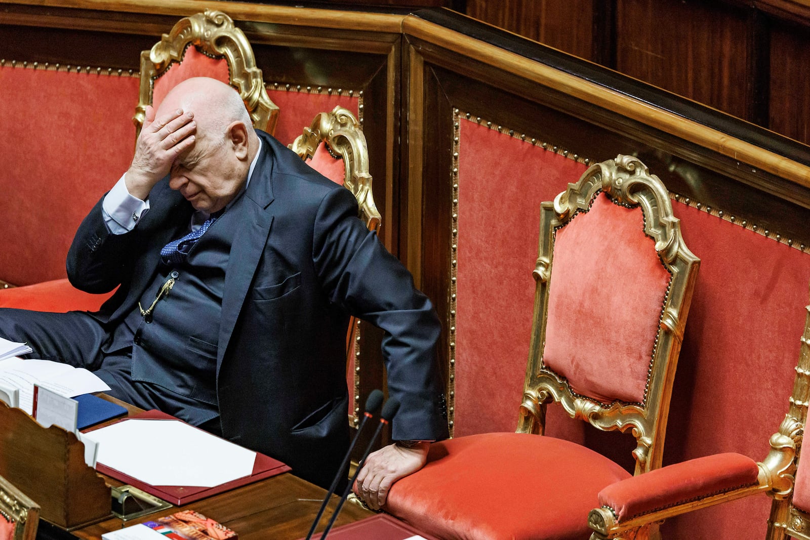 Justice Minister Carlo Nordio puts his hand to his head during the presentation of the report on the justice administration, at the Senate, in Rome, Wednesday, Jan. 22, 2025. (Roberto Monaldo//LaPresse via AP)