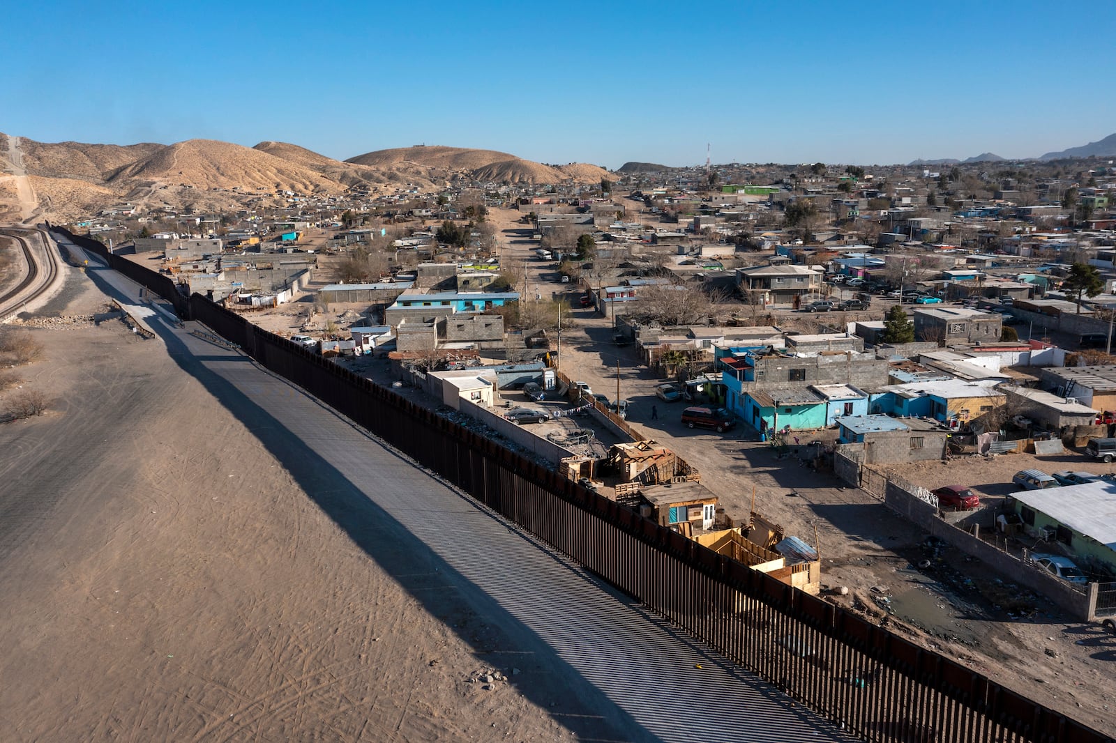 The Anapra neighborhood of Ciudad Juarez, Mexico, is pictured behind the border wall from the Sunland Park area of New Mexico, Monday, Jan. 20, 2025. (AP Photo/Andres Leighton)