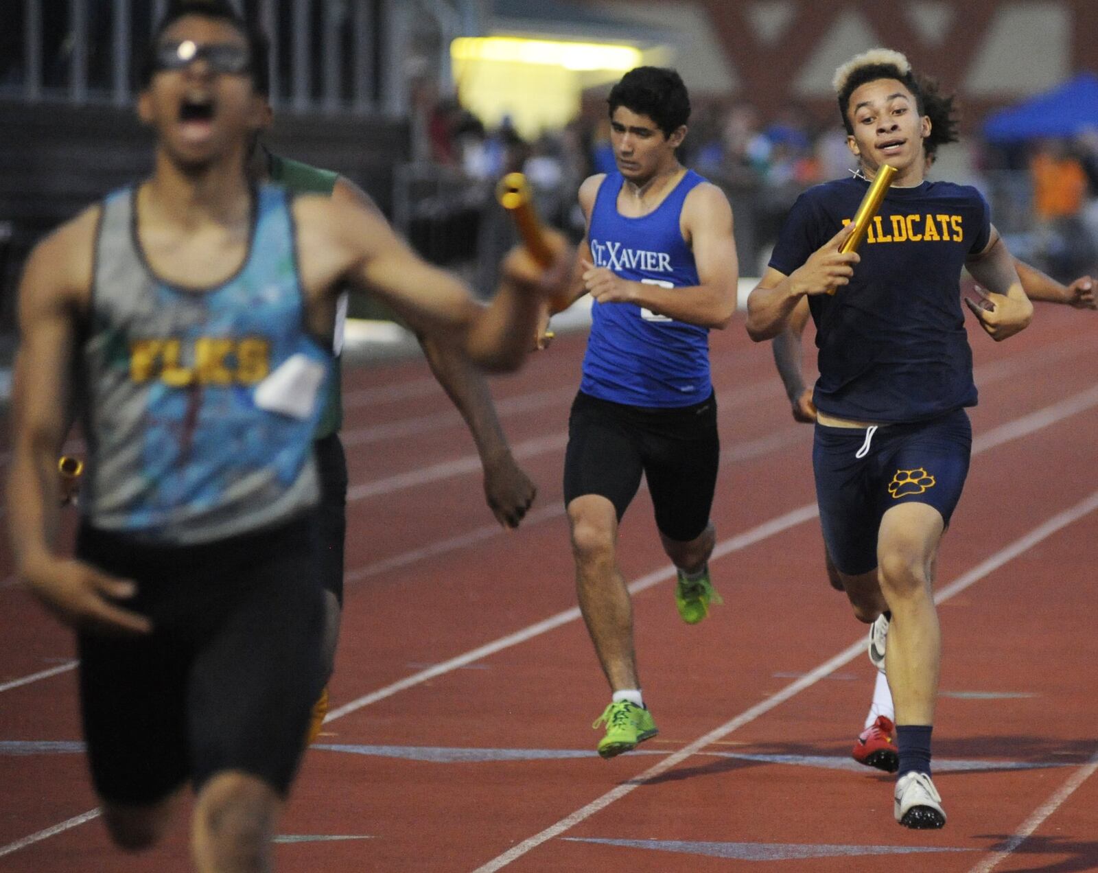 Springfield sophomore anchor Cameron Elliott (right) places third in the 1,600-meter relay during the D-I regional track and field meet at Wayne High School on Friday, May 24, 2019. MARC PENDLETON / STAFF