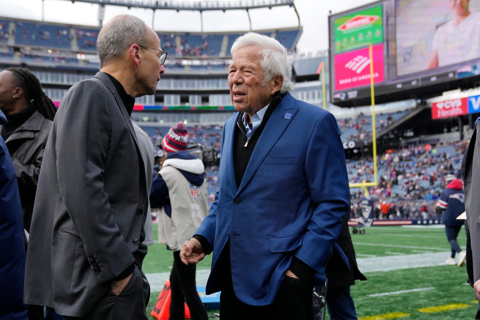 New England Patriots owner Robert Kraft, right, talks with his son Jonathan prior to an NFL football game against the Buffalo Bills, Sunday, Jan. 5, 2025, in Foxborough, Mass. (AP Photo/Robert F. Bukaty)