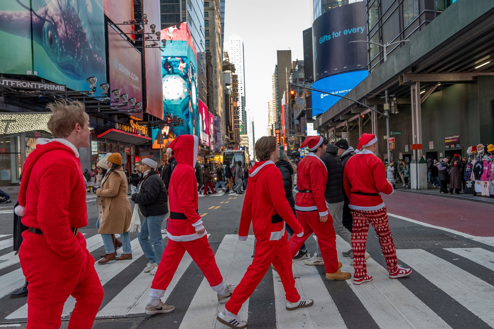 Revellers take part in SantaCon, Saturday, Dec. 14, 2024, in New York. (AP Photo/Julia Demaree Nikhinson)